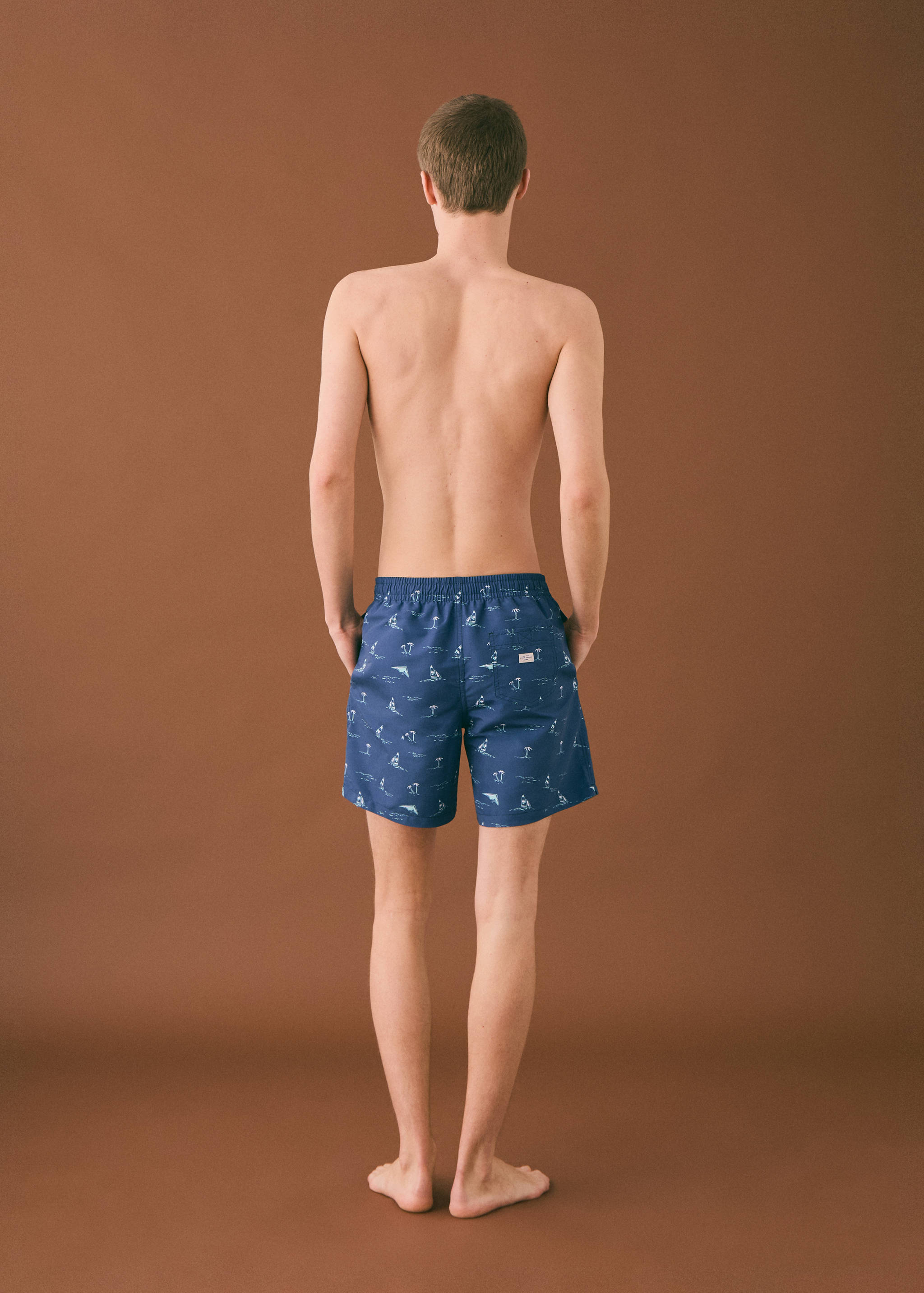 Palm trees print swimsuit trunks - Reverse of the article