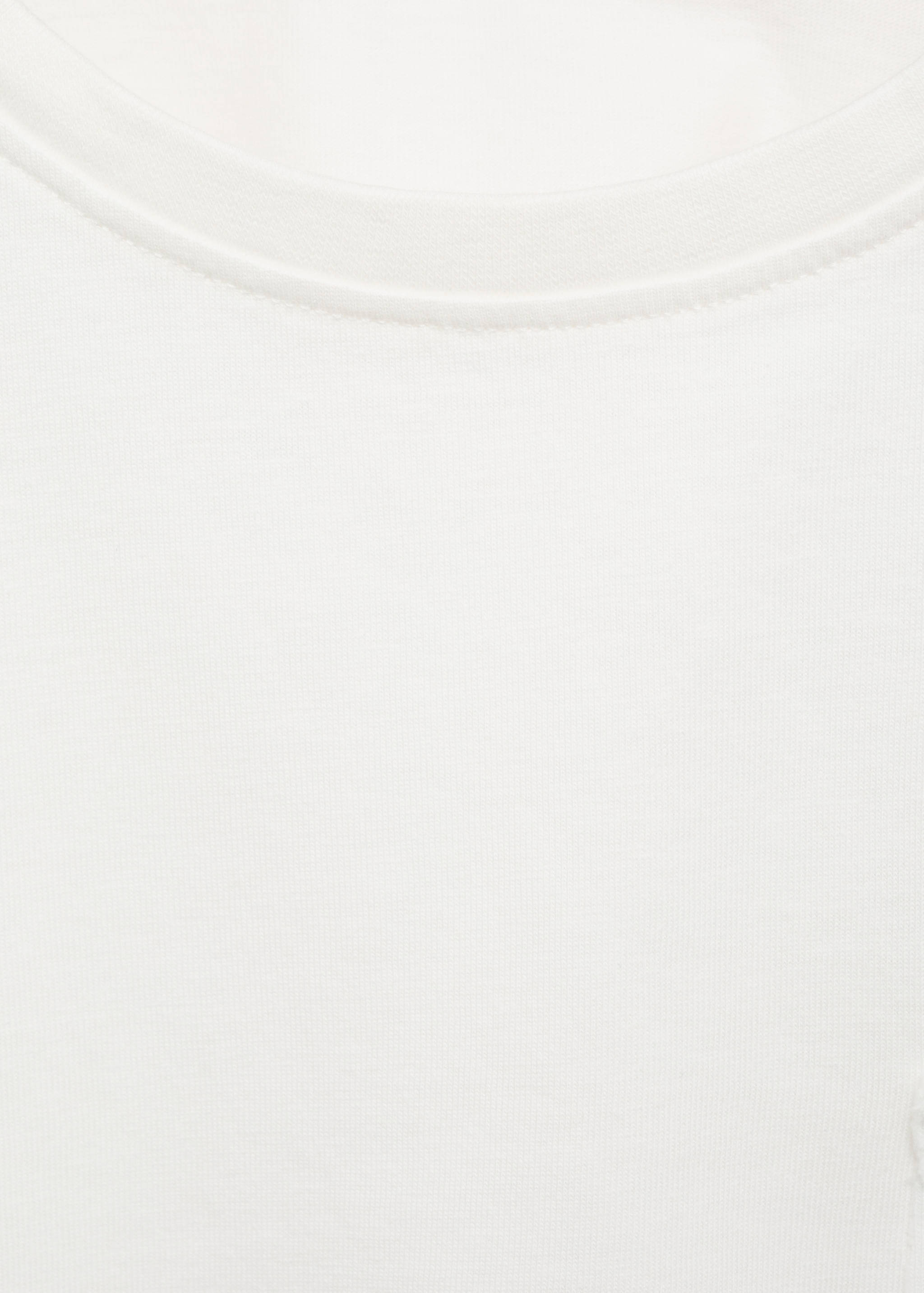 White t-shirt crew neckline detail.