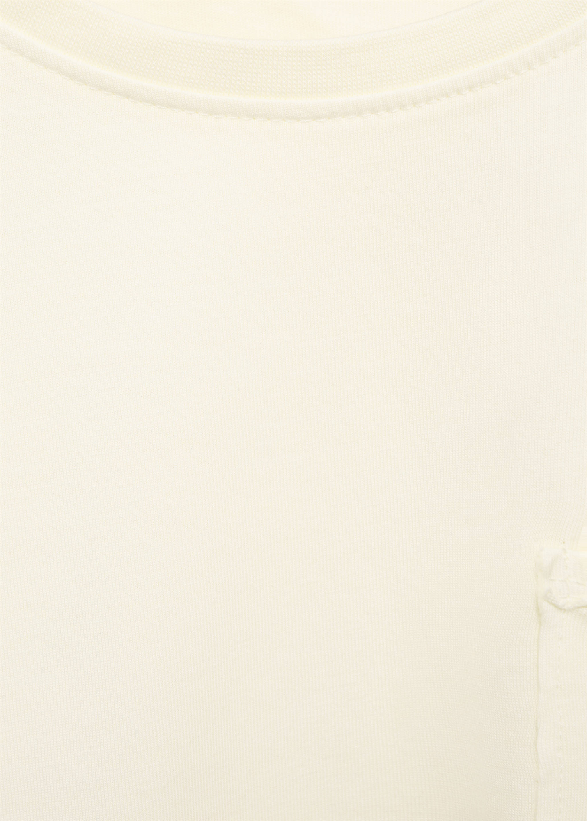 Off-white kids' t-shirt detail showing the neckline and chest pocket.