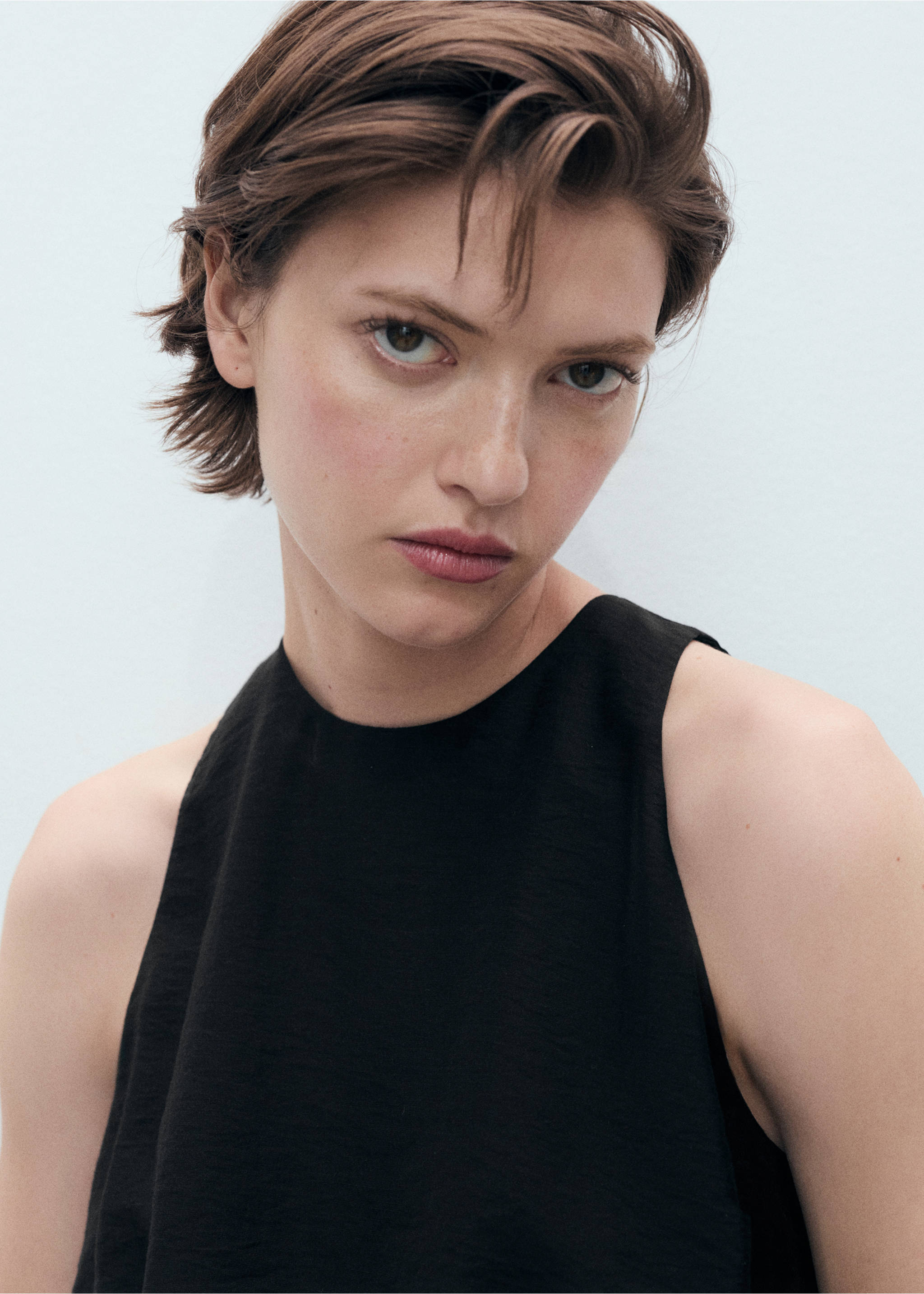 Lyocell-blend top with puffed hem - Details of the article 1, Black. Ref: 87008652-00.