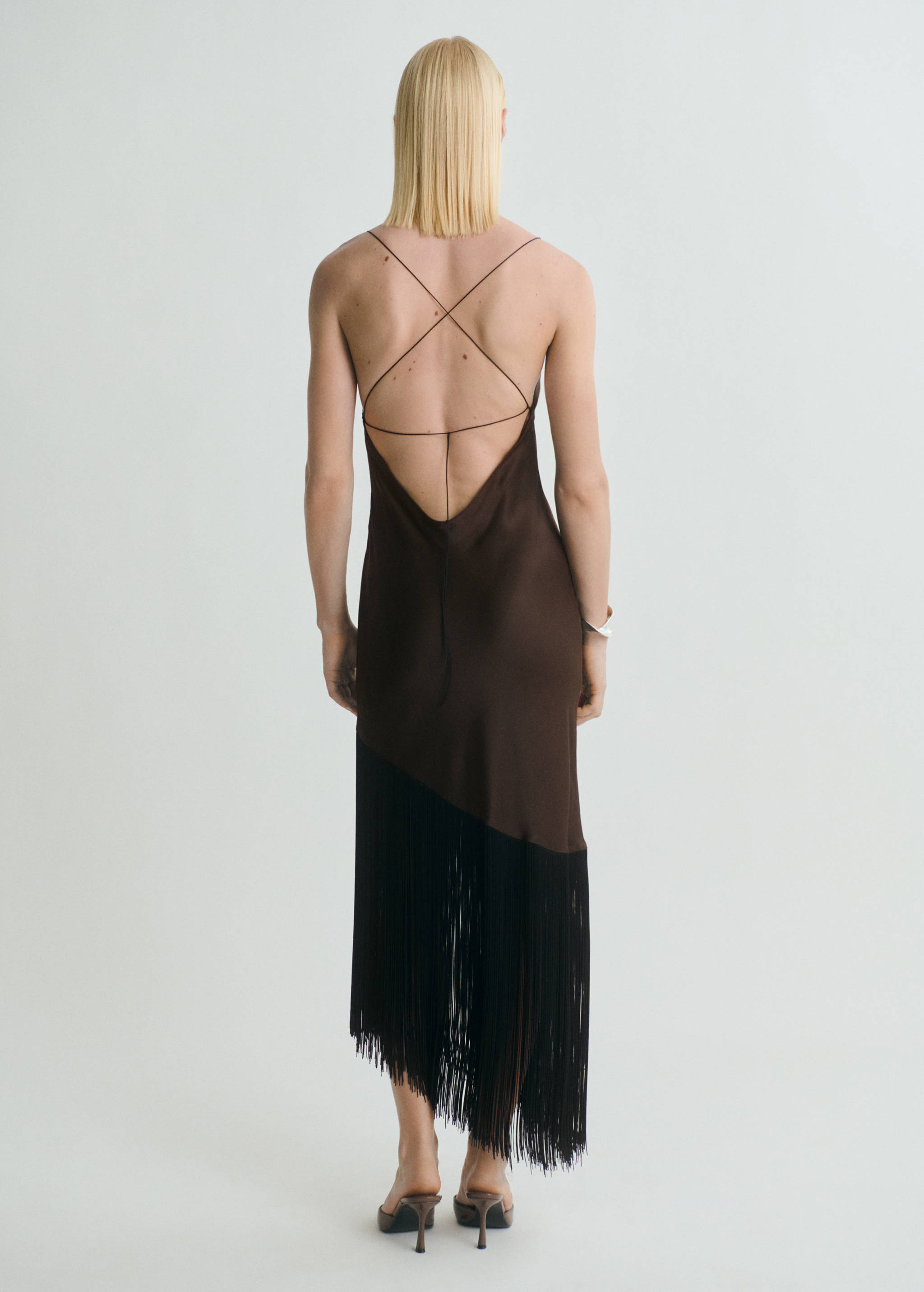 Asymmetrical satin dress with fringes - Reverse of the article