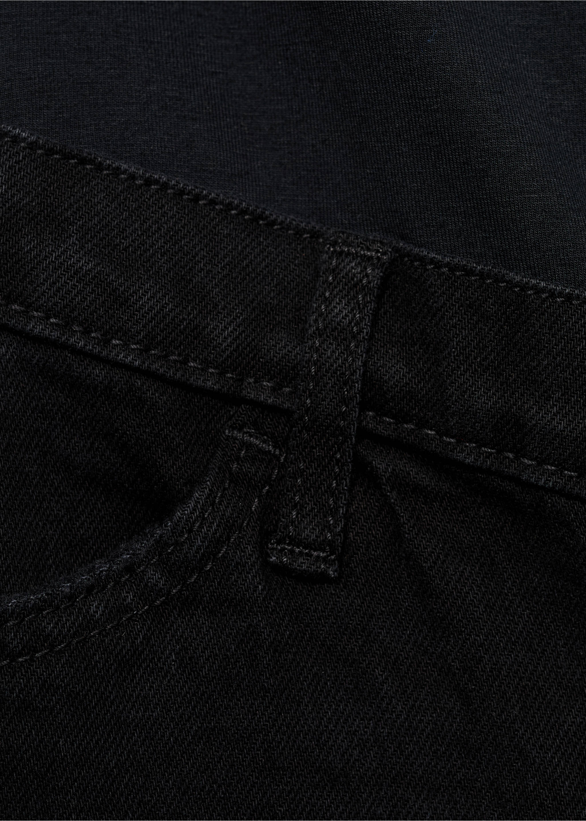 Close-up of black denim trousers waistband and pocket detail., Black denim. Ref: 87010266-00.