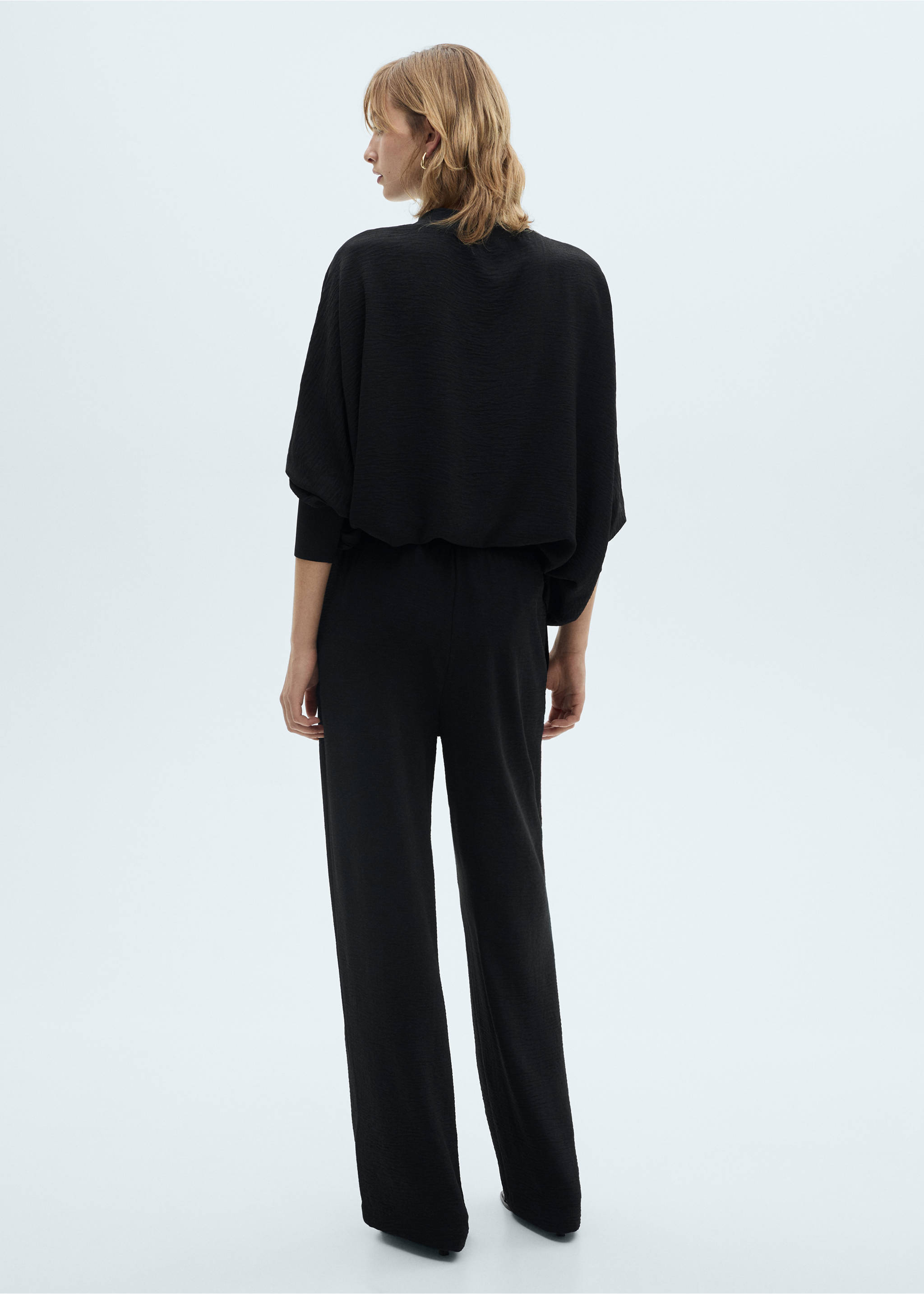 Straight knitted trousers - Reverse of the article, Black. Ref: 87011047-00.
