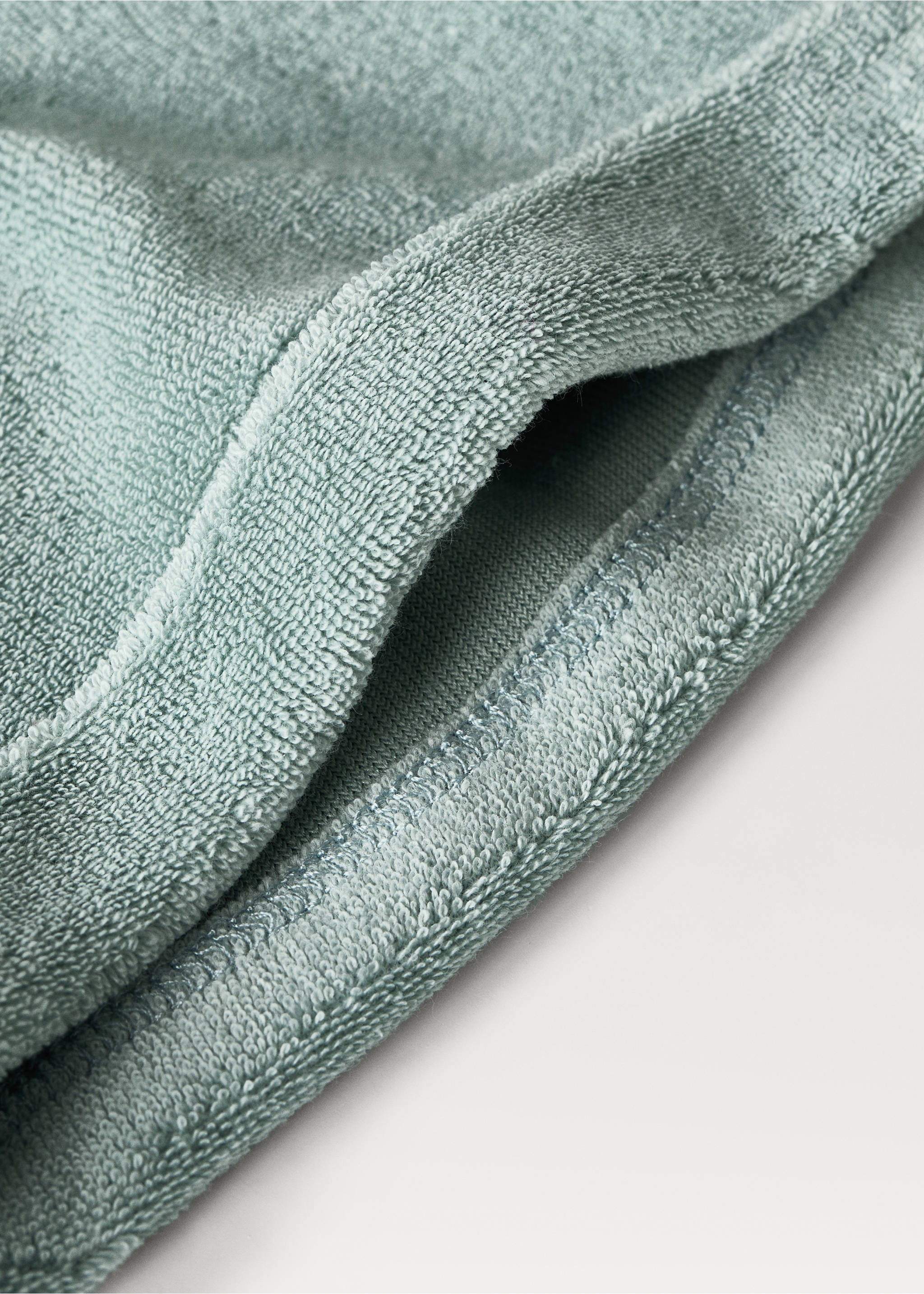 Sage green terry cotton product detail with textured loop pile and stitched edge., Mint Green. Ref: 87023657-00.