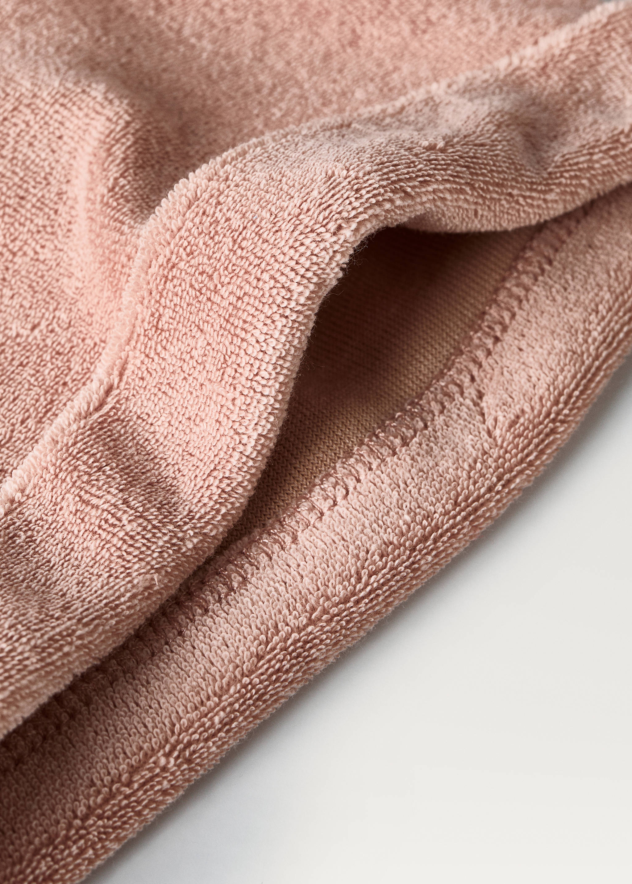 Dusty pink terry cotton towel hat detail.