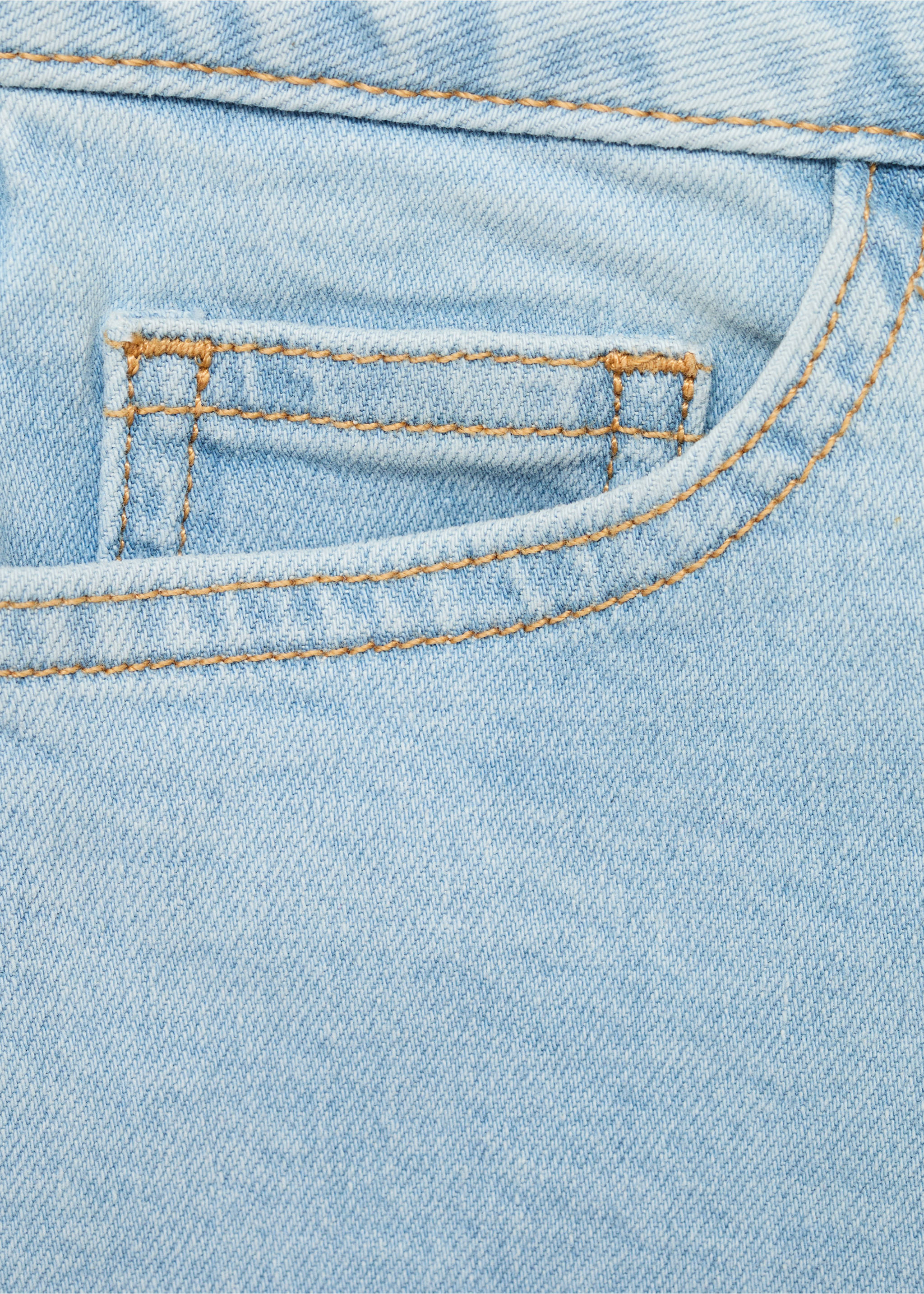 Close-up of light blue denim fabric detail on kids shorts with contrast stitching., Light Blue. Ref: 87025947-00.