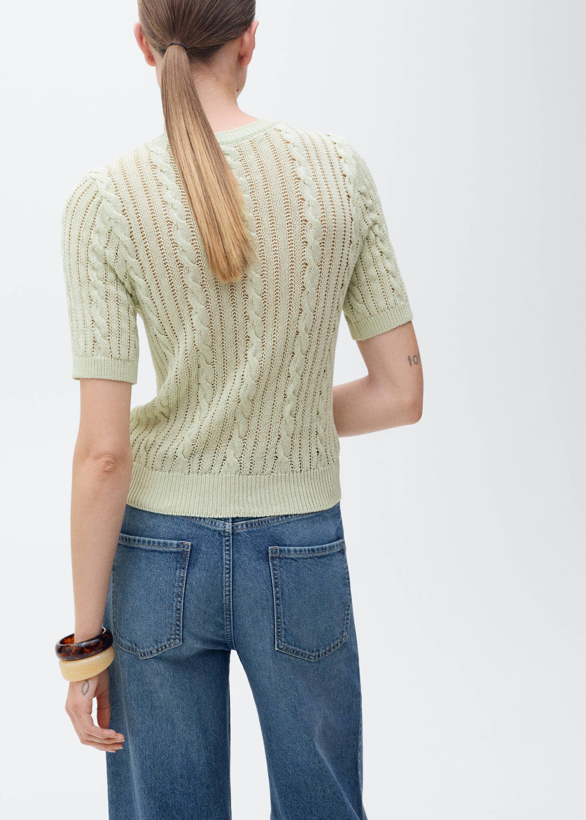 Short-sleeved cable-knit sweater - Reverse of the article