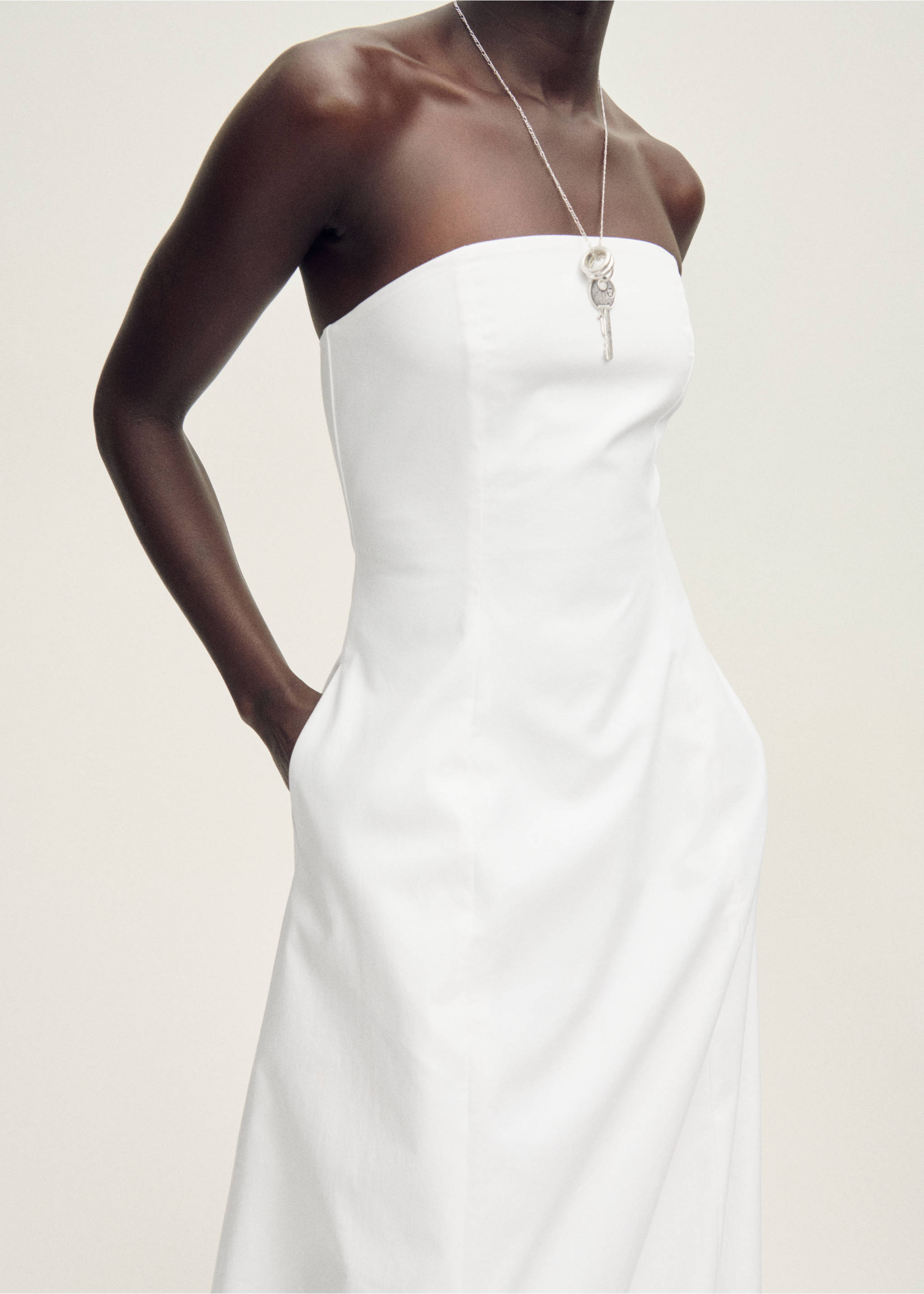 Strapless dress with puffed hem - Details of the article 6, White. Ref: 87028278-00.