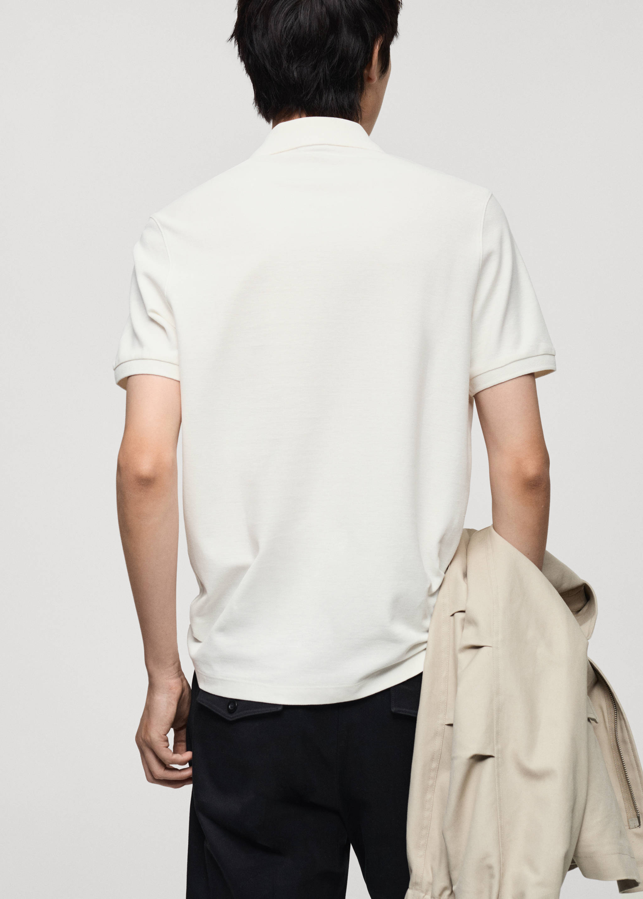 100% cotton polo shirt with embroidered graphic on the chest - Reverse of the article