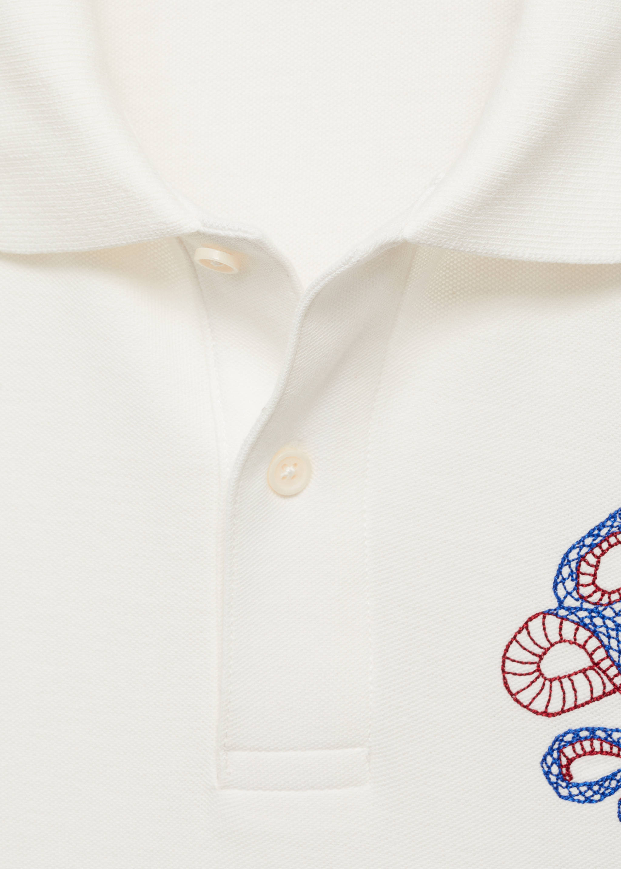 100% cotton polo shirt with embroidered graphic on the chest - Details of the article 0