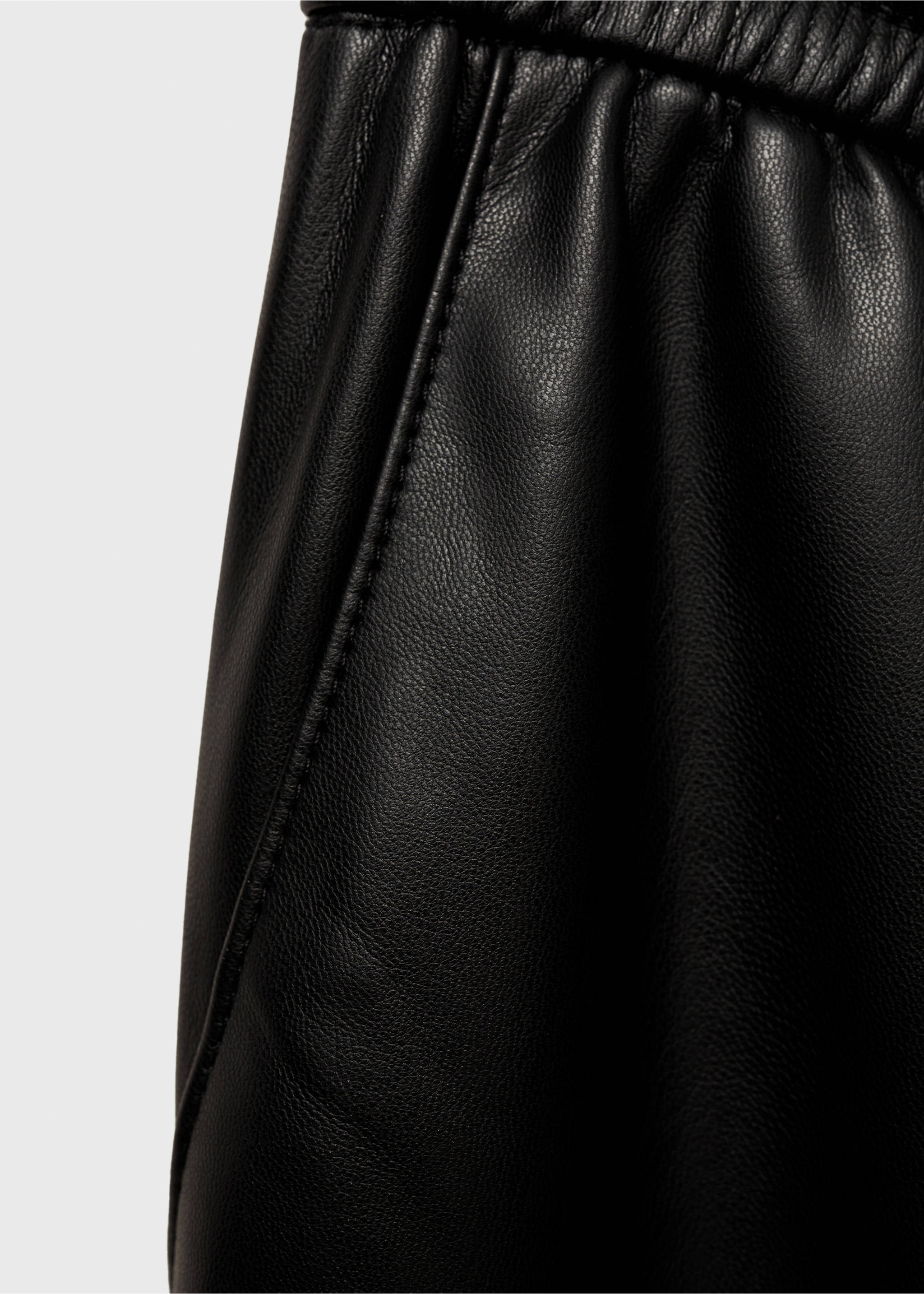 Faux-leather trousers with elastic waist - Details of the article 0, Black. Ref: 87030436-00.