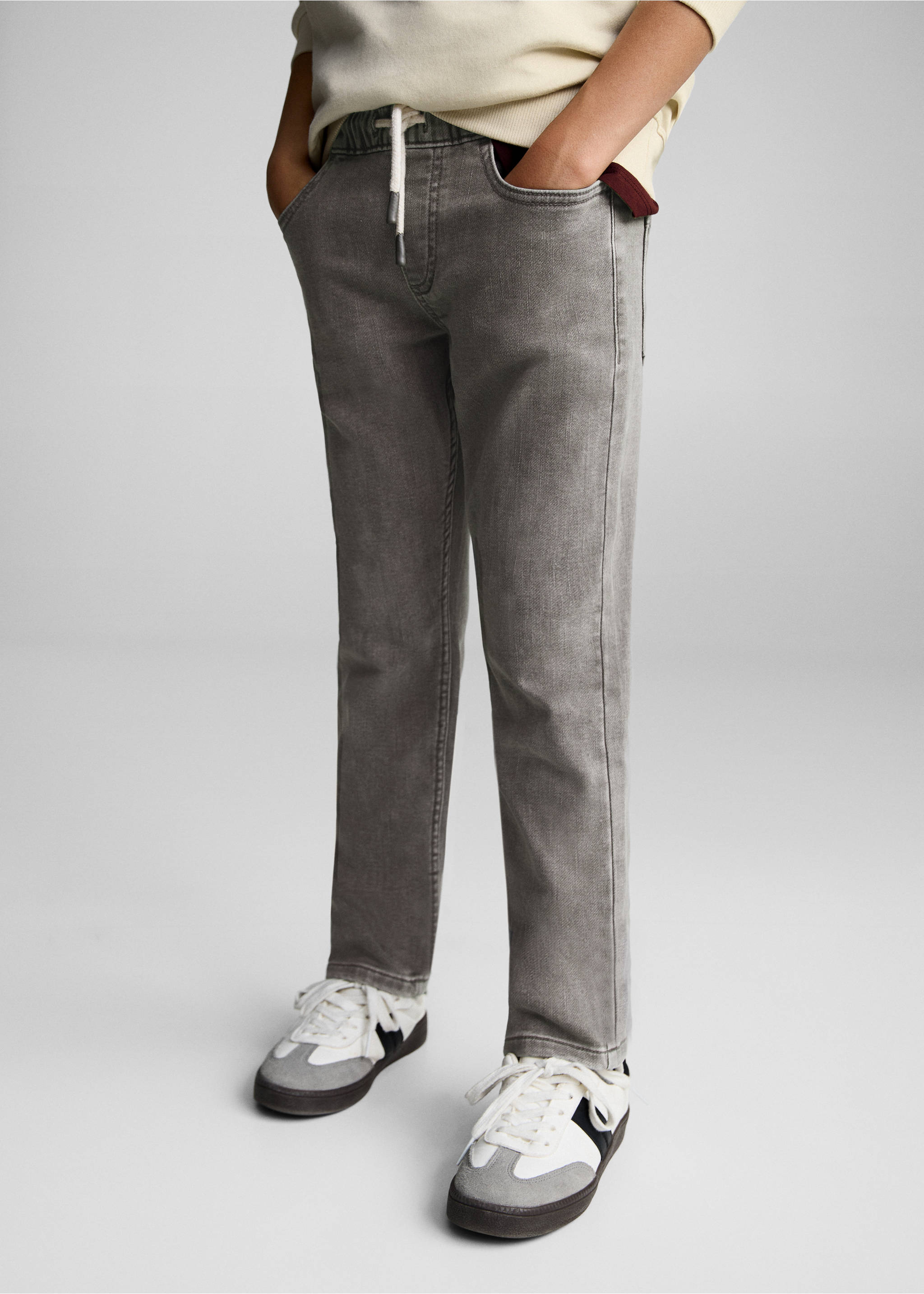 Jeans mit Tunnelzug - Detail des Artikels 6, Denim Grau. Ref: 87030622-00.