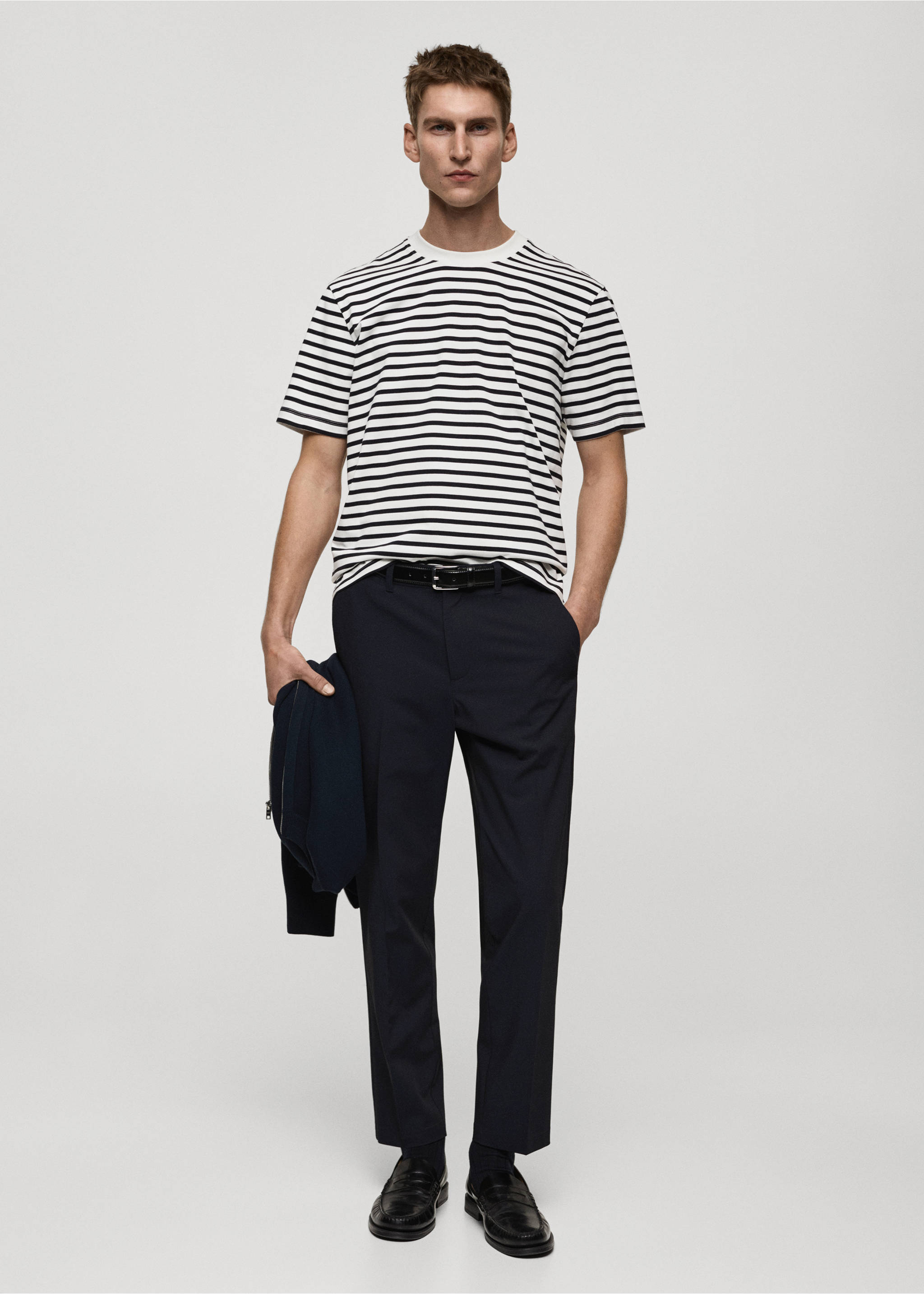 Dark navy trousers worn with a striped t-shirt and black loafers., Dark Navy. Ref: 87032889-00.