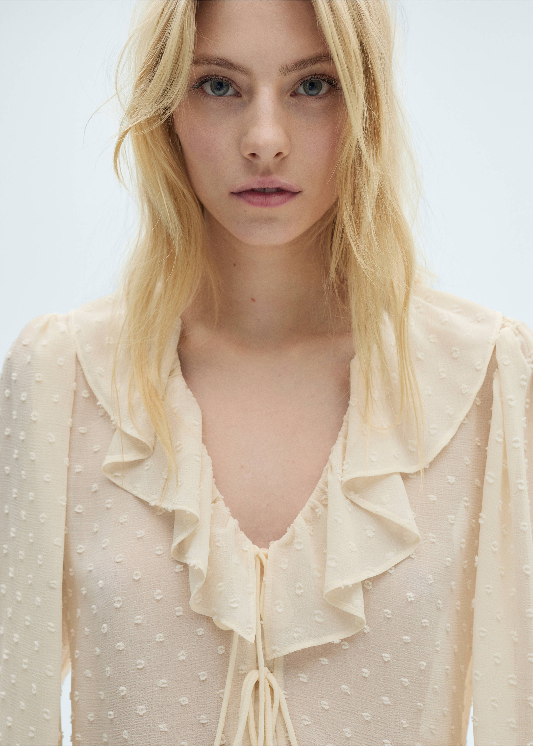 Ruffled blouse with bow closure - Details of the article 1, Ecru. Ref: 87034074-00.