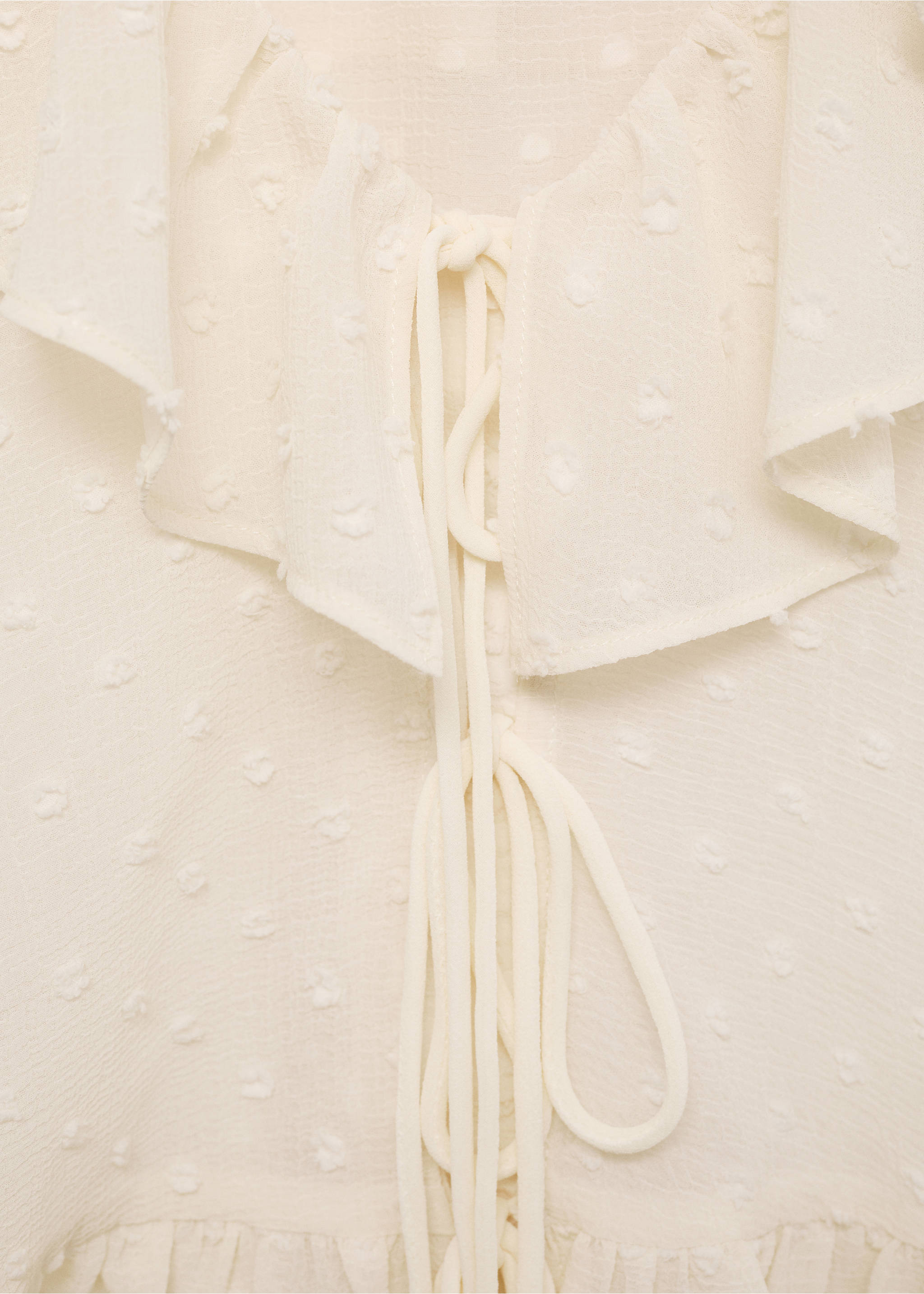 Ruffled blouse with bow closure - Details of the article 8, Ecru. Ref: 87034074-00.