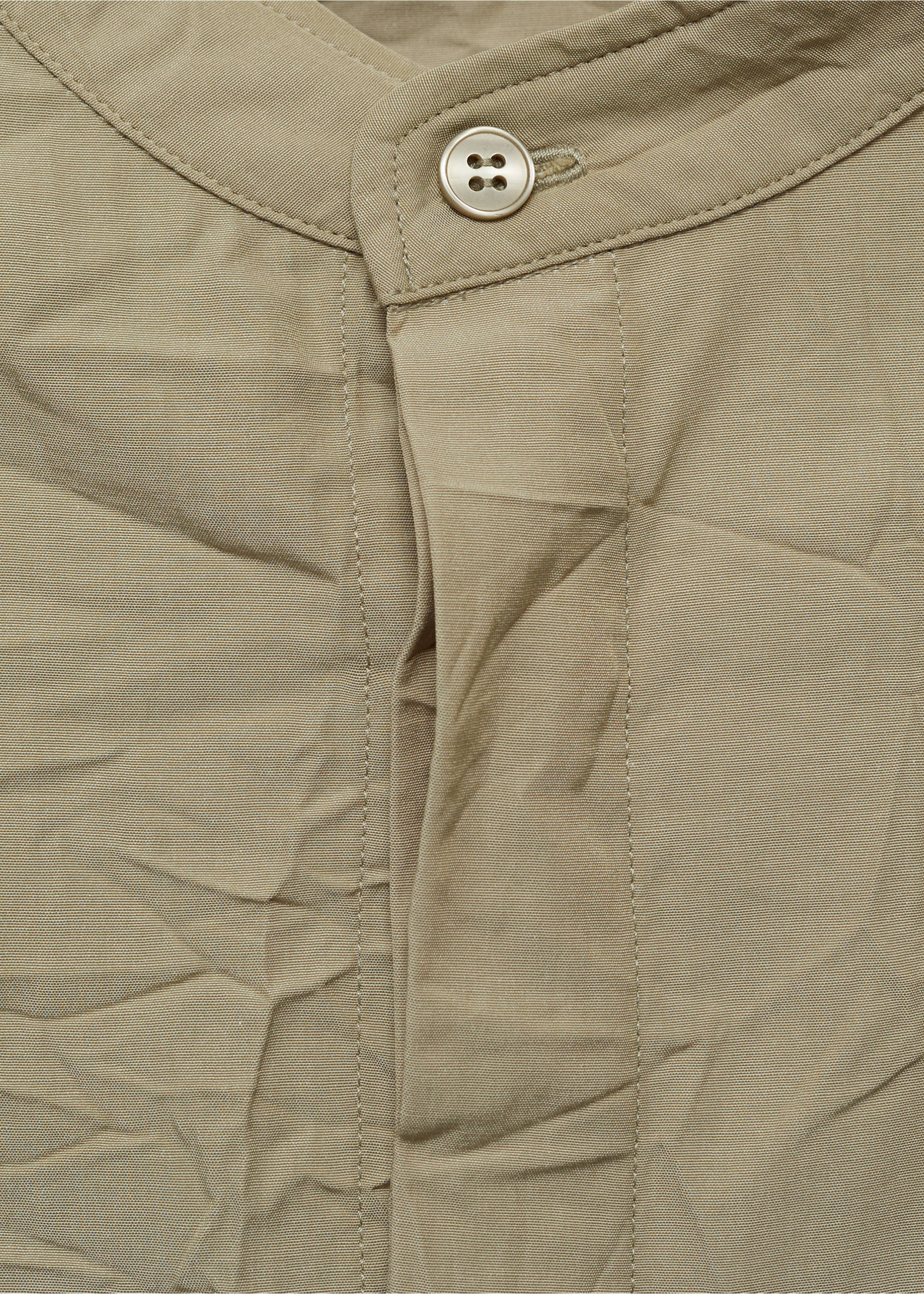 Crew-neck shirt with creased effect - Details of the article 8, Pastel Green. Ref: 87034425-00.