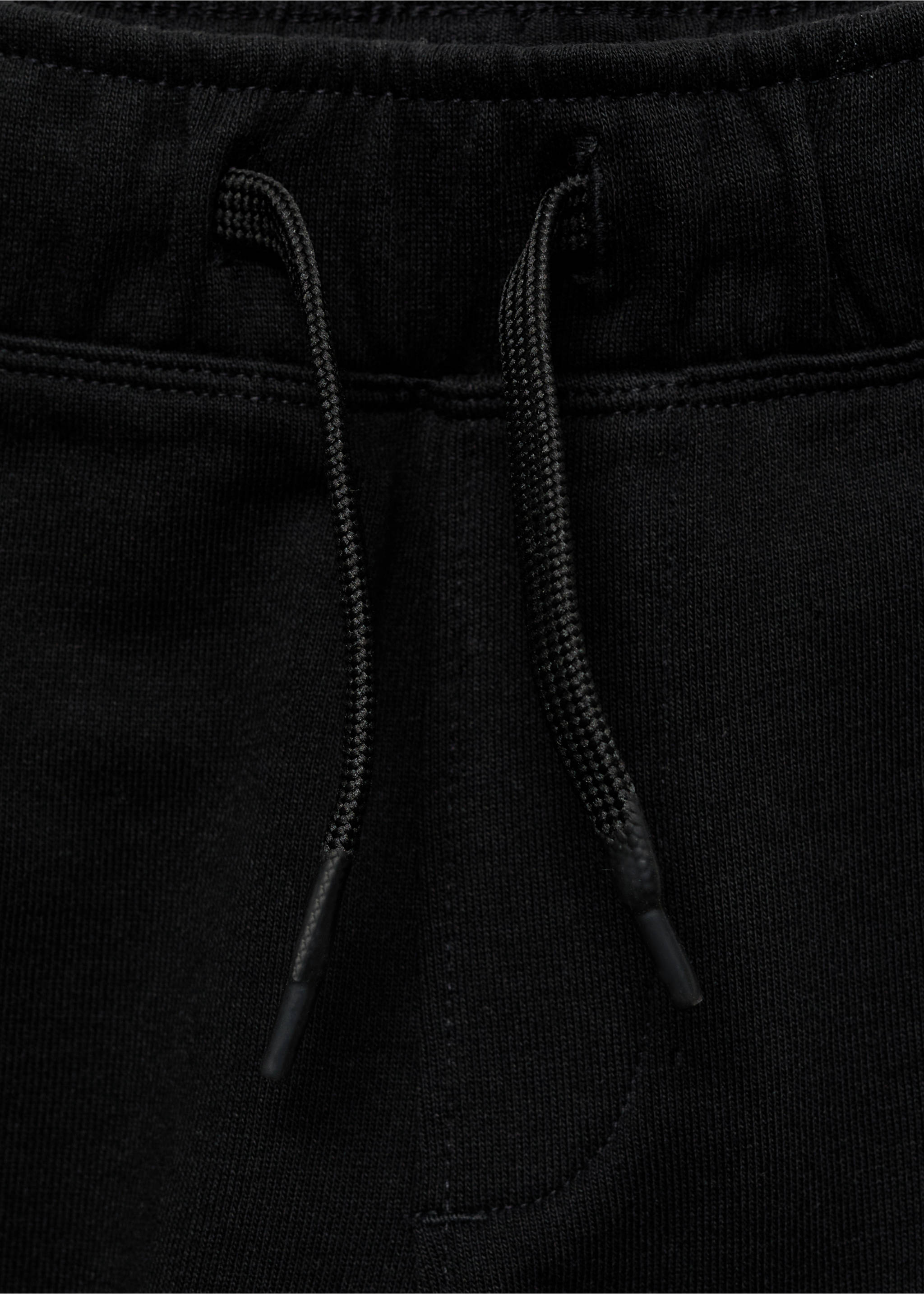 Cotton jogger-style trousers - Details of the article 8, Black. Ref: 87035137-00.