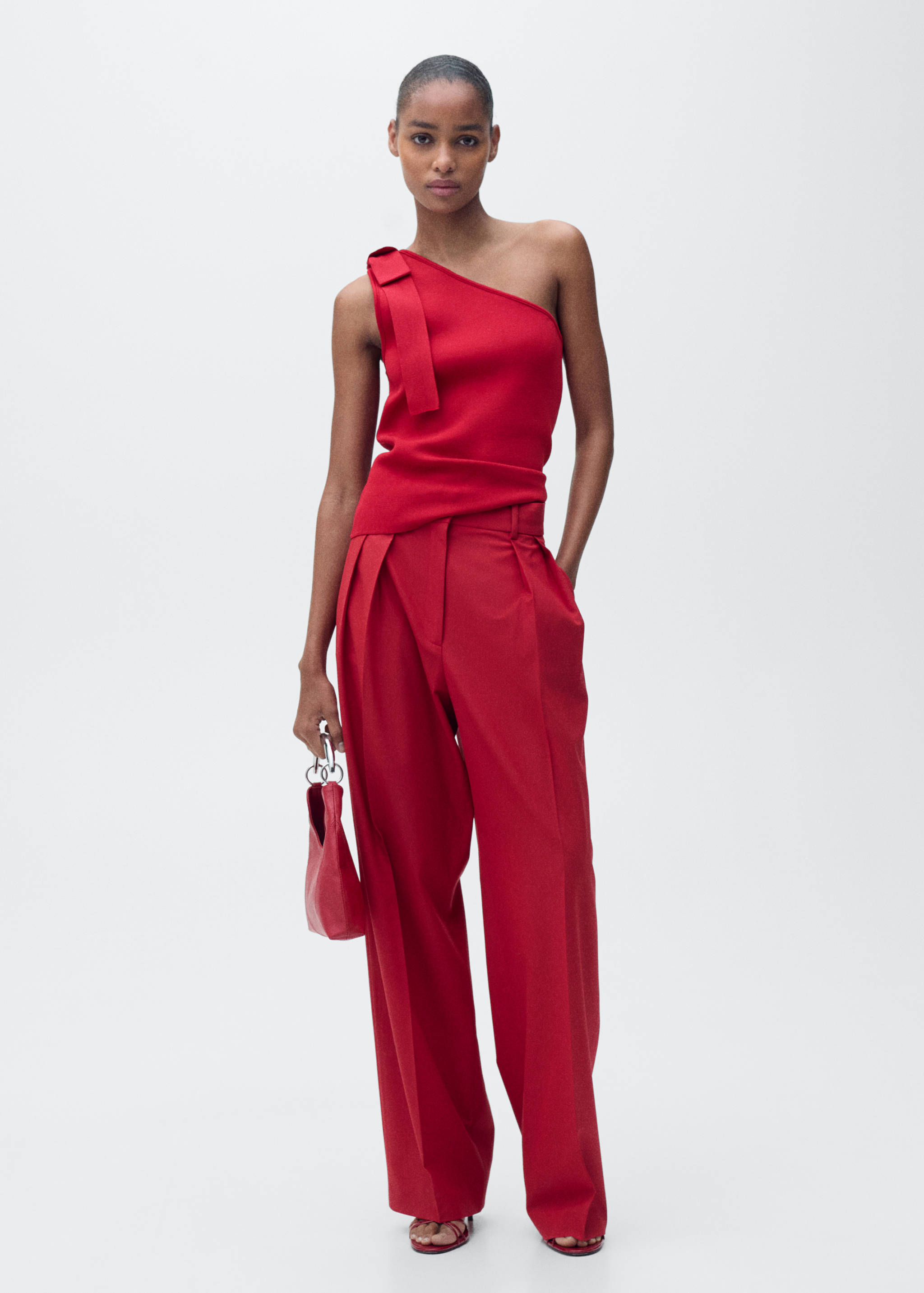 Asymmetrisk stickad topp med rosett - Allmän bild