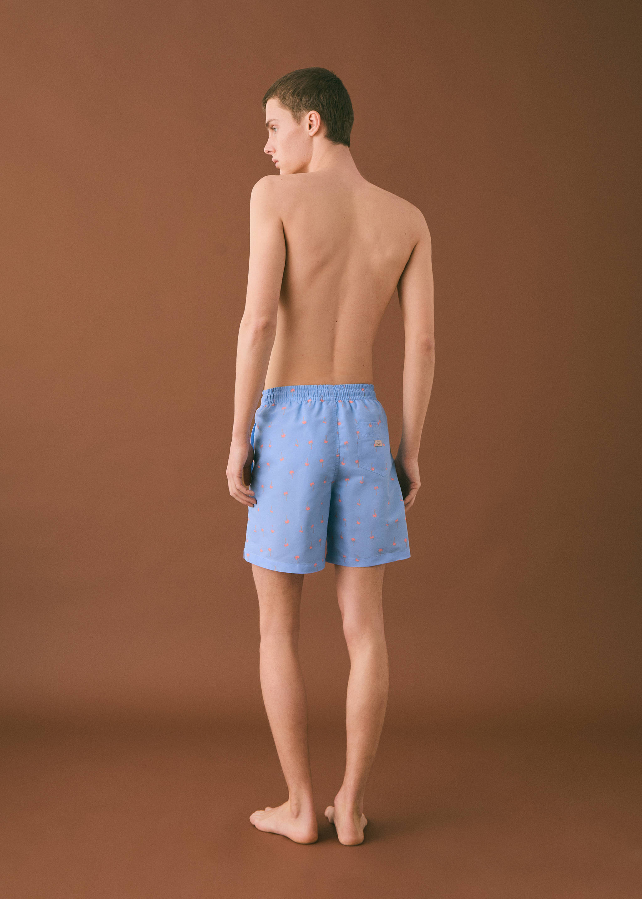 Palm trees print swimsuit trunks - Reverse of the article