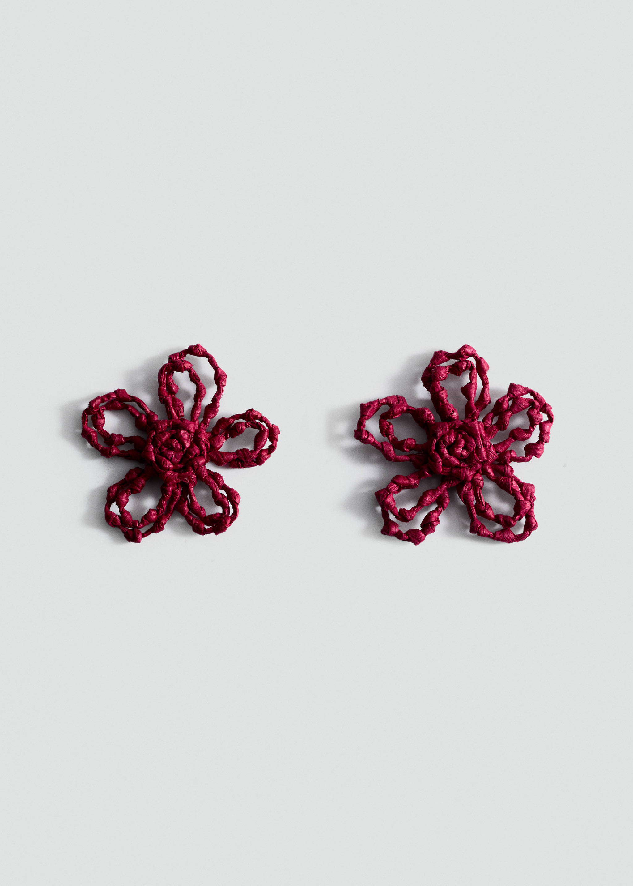 Burgundy woven flower earrings.