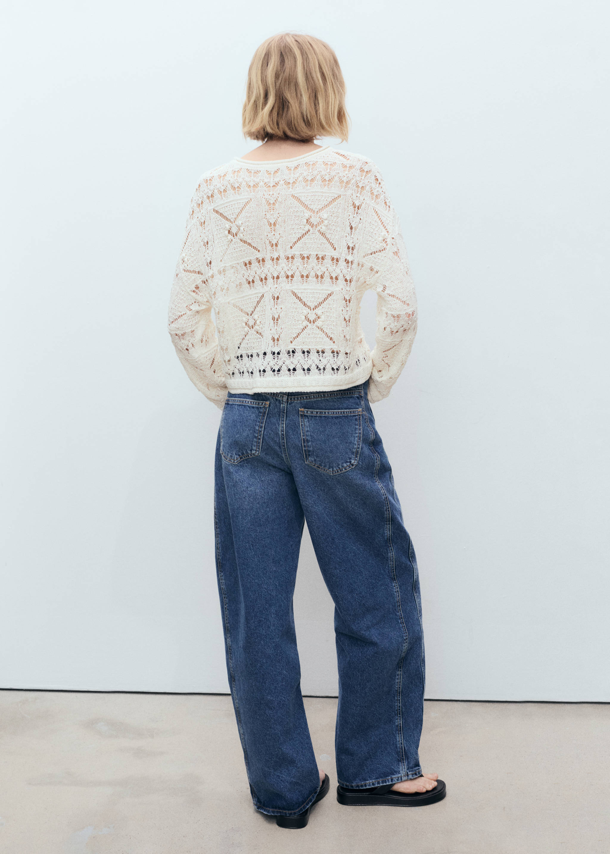 Oversized knitted sweater with lace accents - Reverse of the article