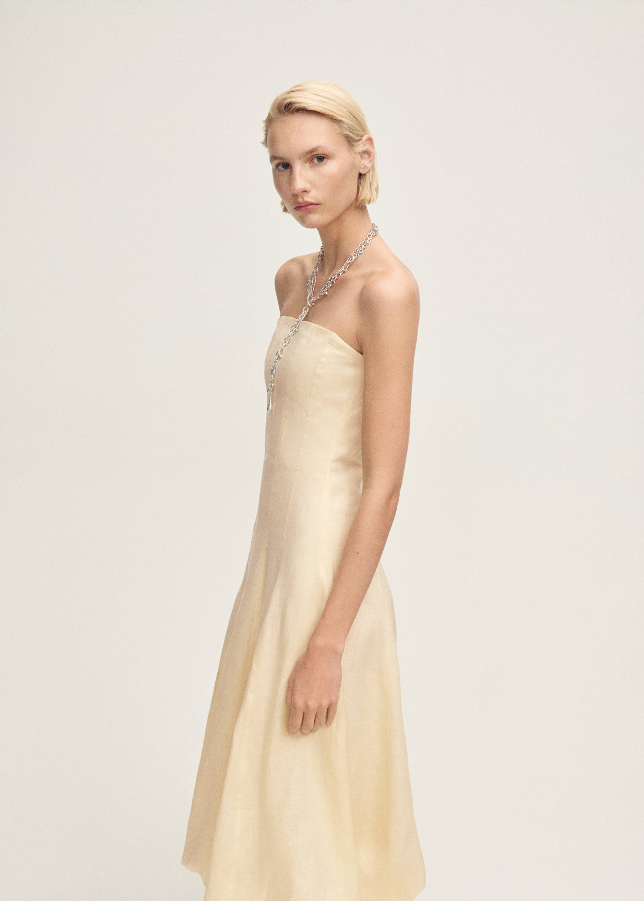 Linen dress with puffed hem - Details of the article 2, Pastel Yellow. Ref: 87037903-00.