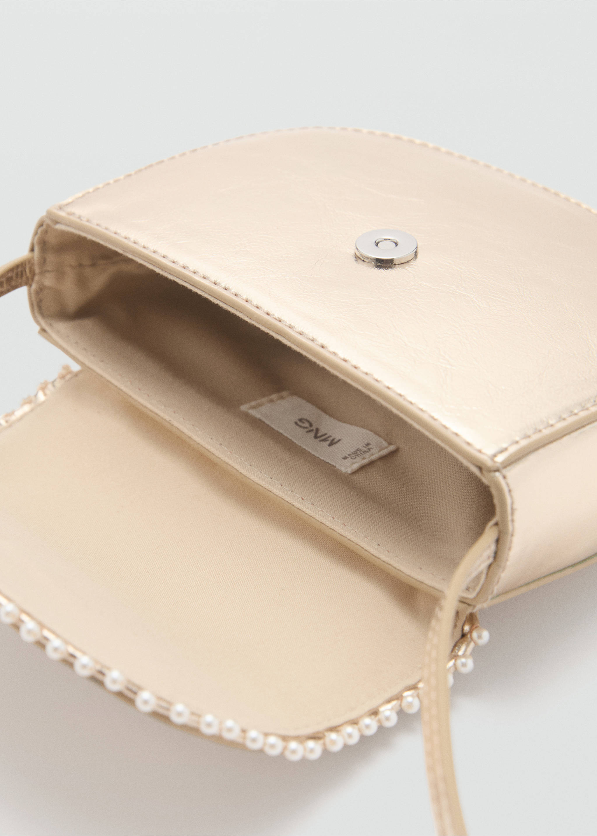 Mini bag with flap - Details of the article 2, Gold. Ref: 87044393-00.