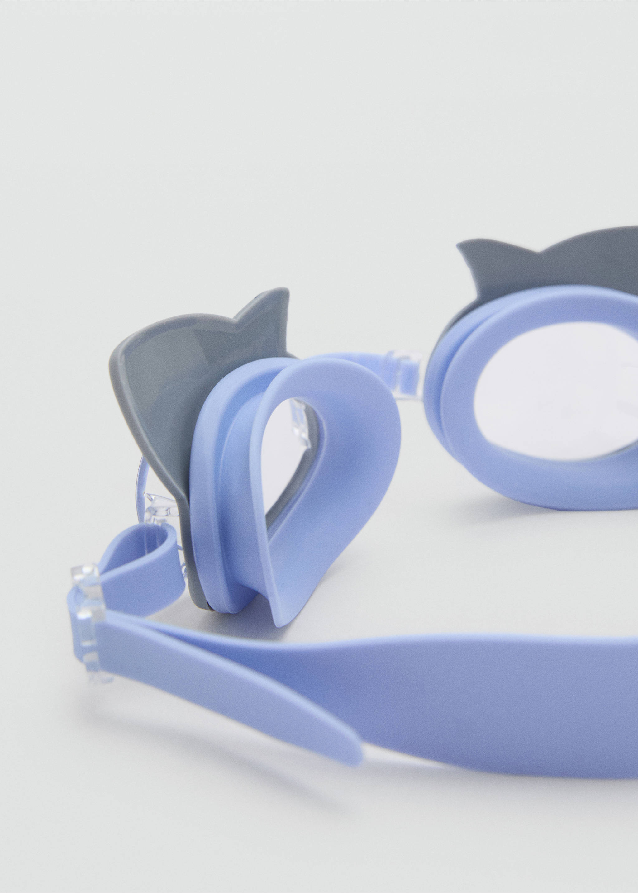 Close-up of light blue kids' diving goggles with shark fin details., Blue. Ref: 87045919-00.