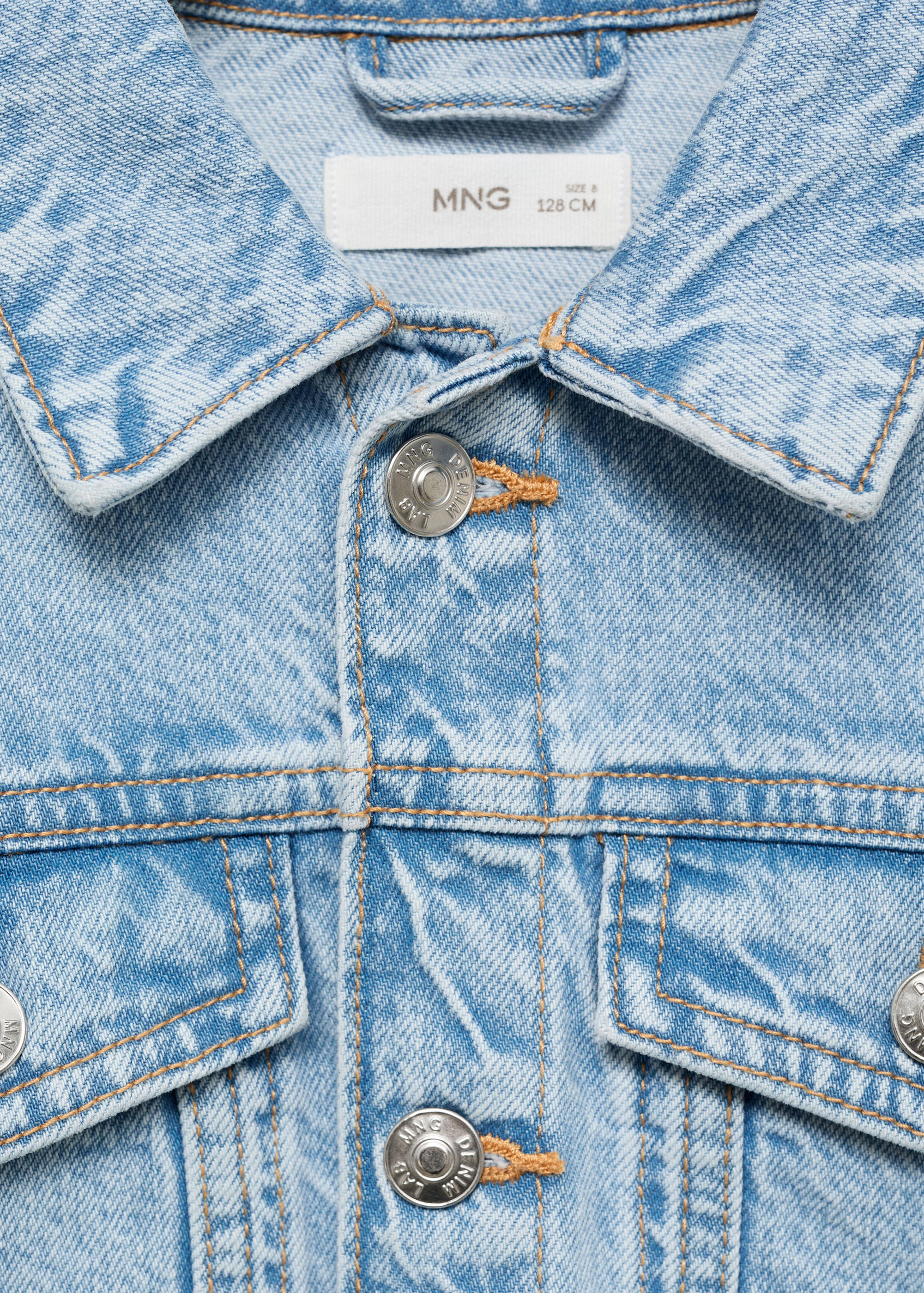 Close-up of a light blue acid-wash denim jacket for kids.