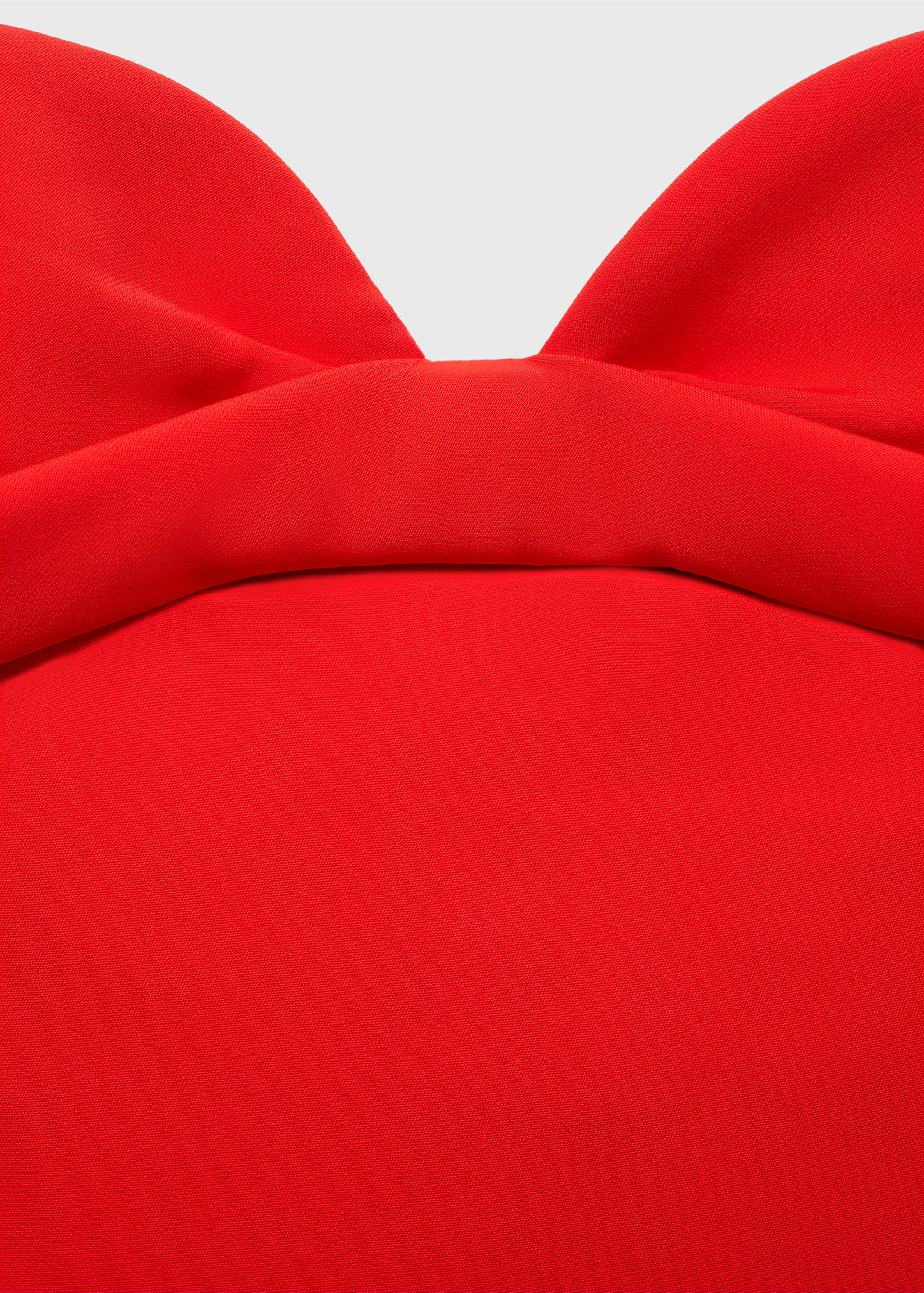 Close-up of a red dress with a sweetheart neckline and draped bodice., Red. Ref: 87045992-00.