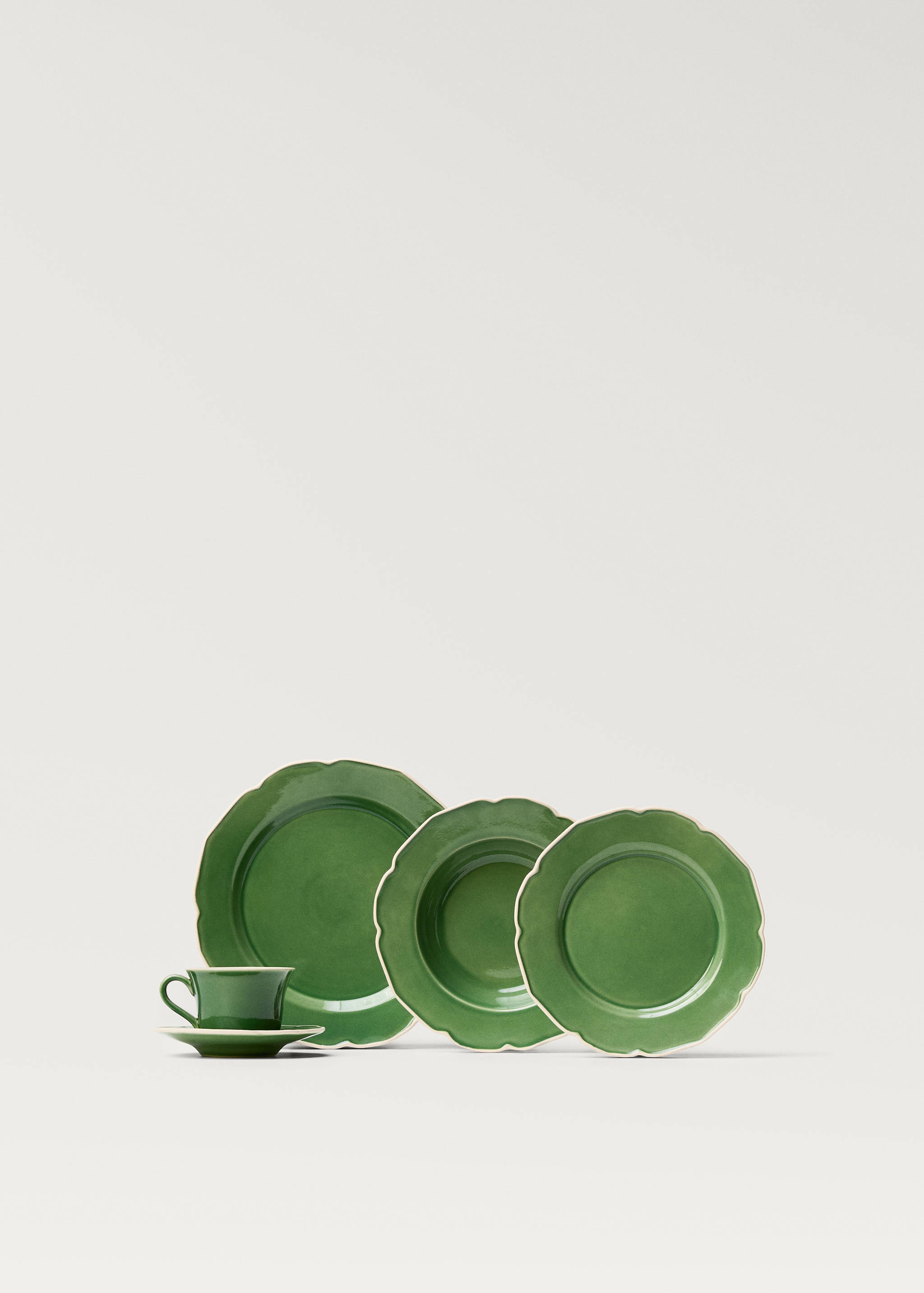 Teetasse aus Steingut mit wellenförmigem Rand - Detail des Artikels 3