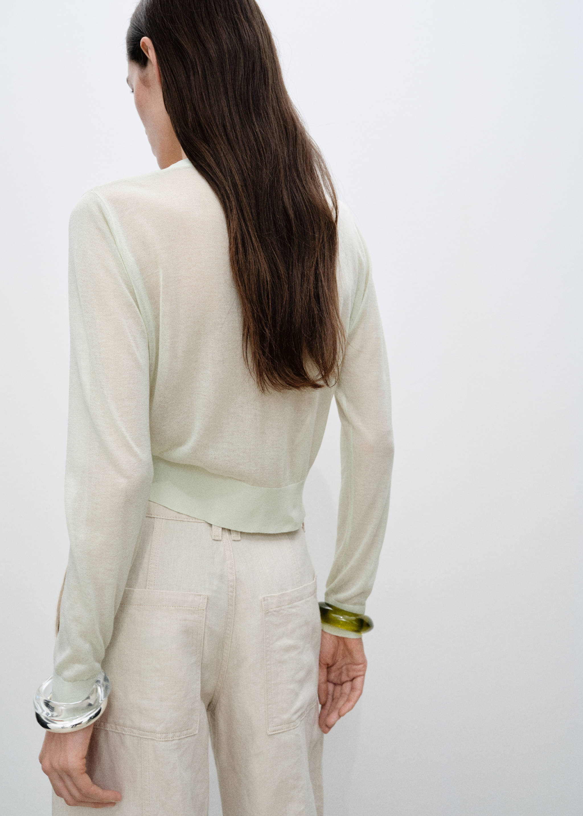 Semi-transparent cropped knitted cardigan - Reverse of the article