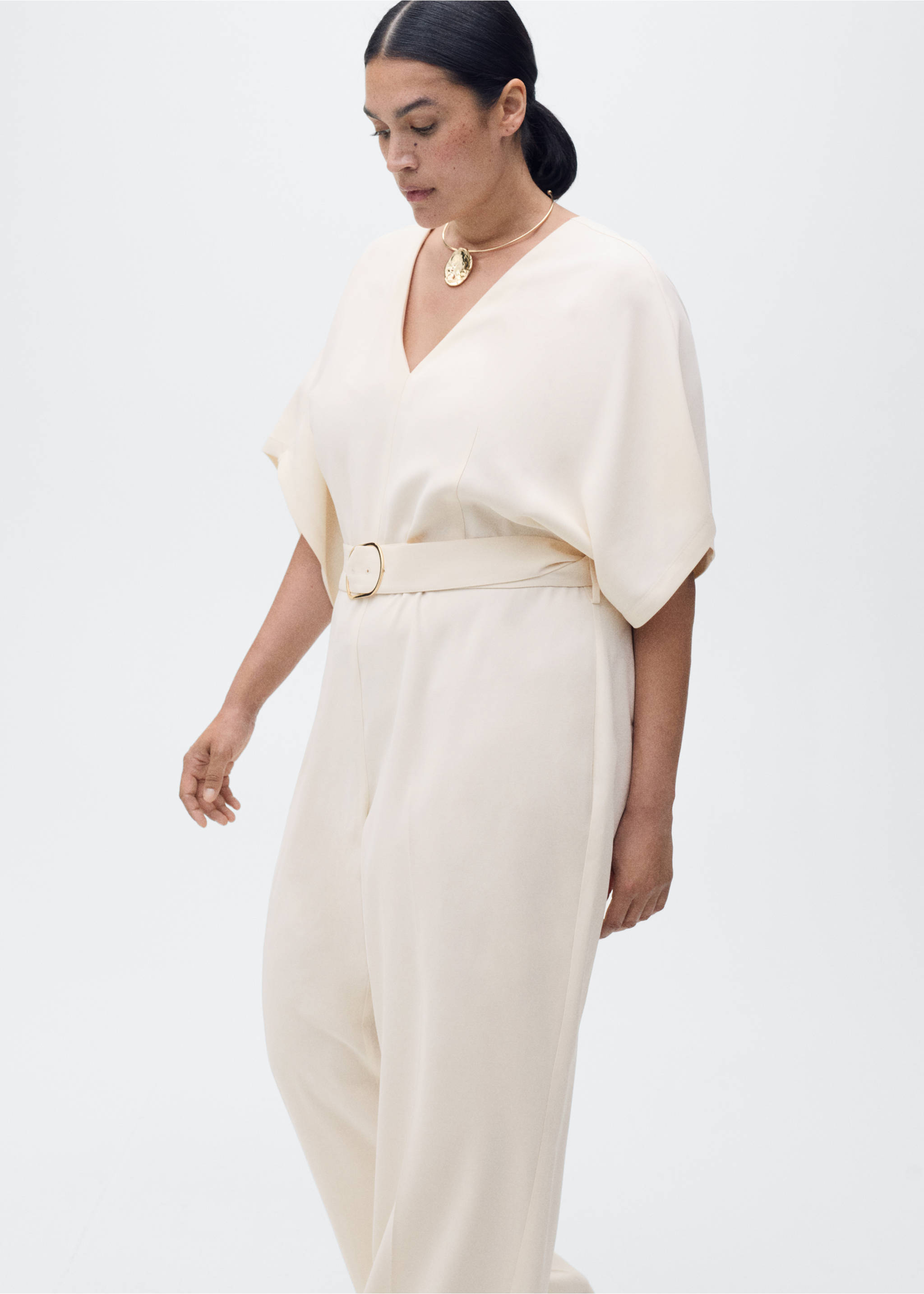 Long jumpsuit with belt and buckle - Details of the article 5, Ecru. Ref: 87055754-00.