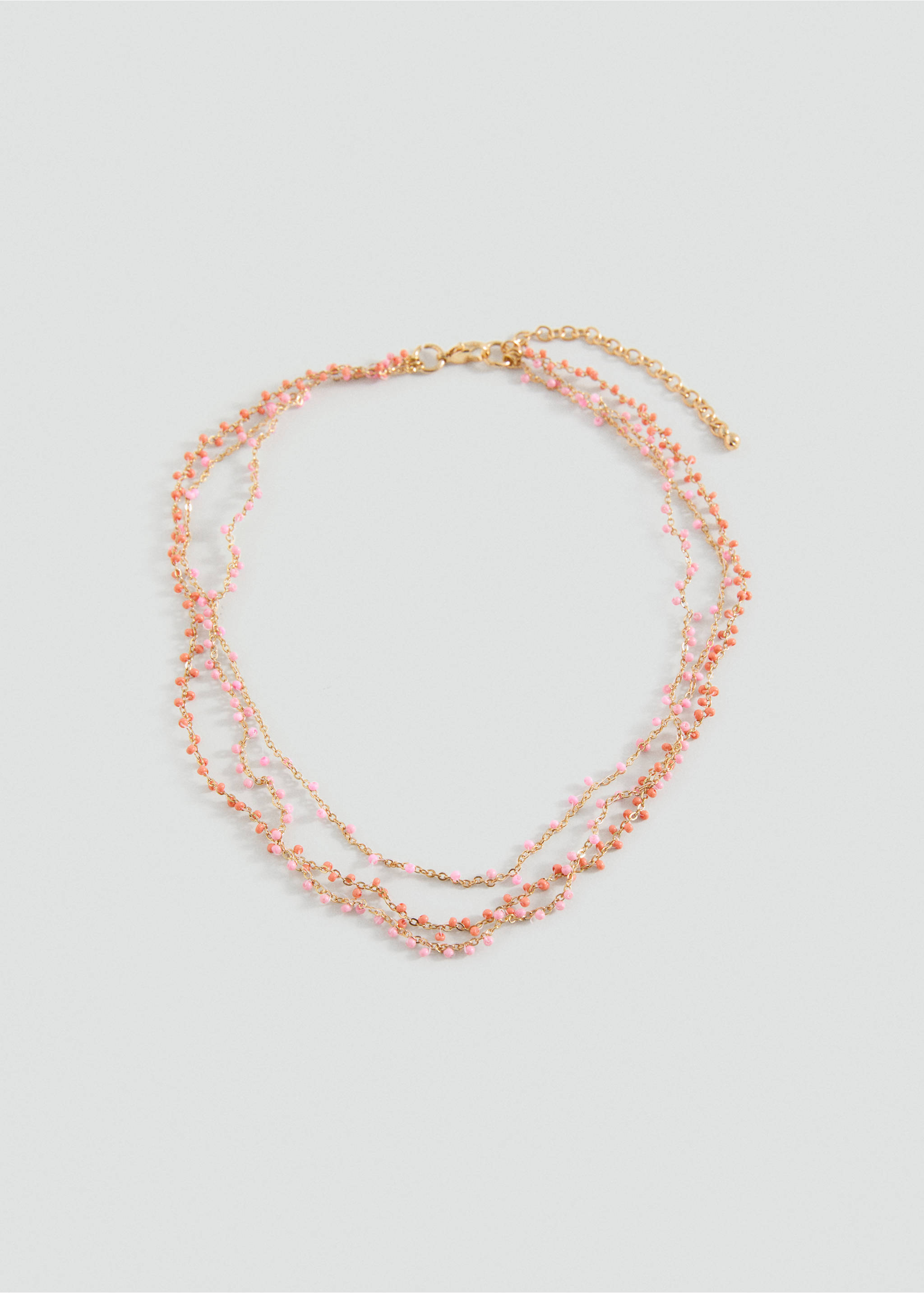 Dreireihige Kette mit Anhängern - Artikel ohne Model, Erdbeerrot. Ref: 87055983-00.