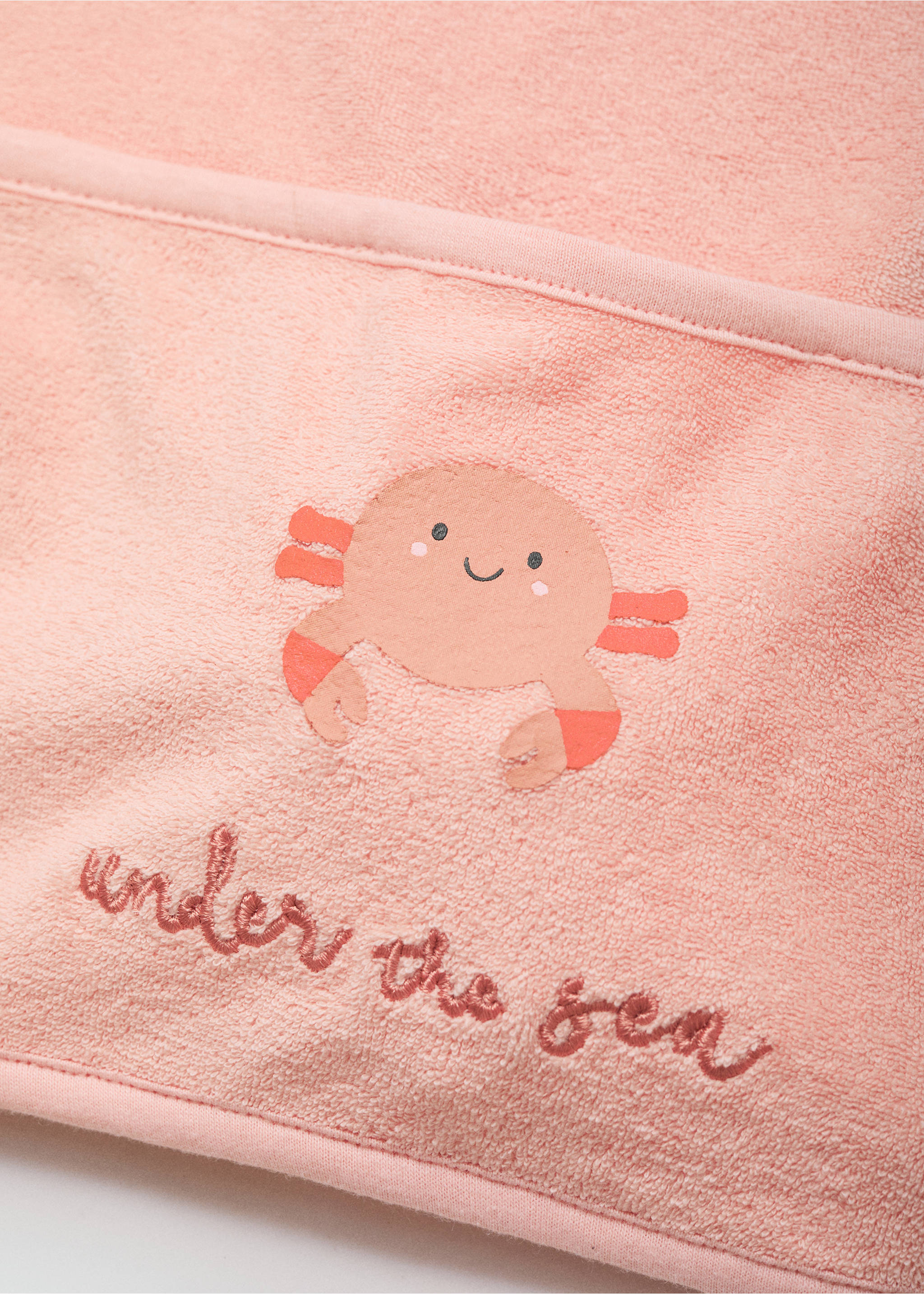 Terry cloth bib with embroidered details - Details of the article 1, Pastel Pink. Ref: 87056718-00.