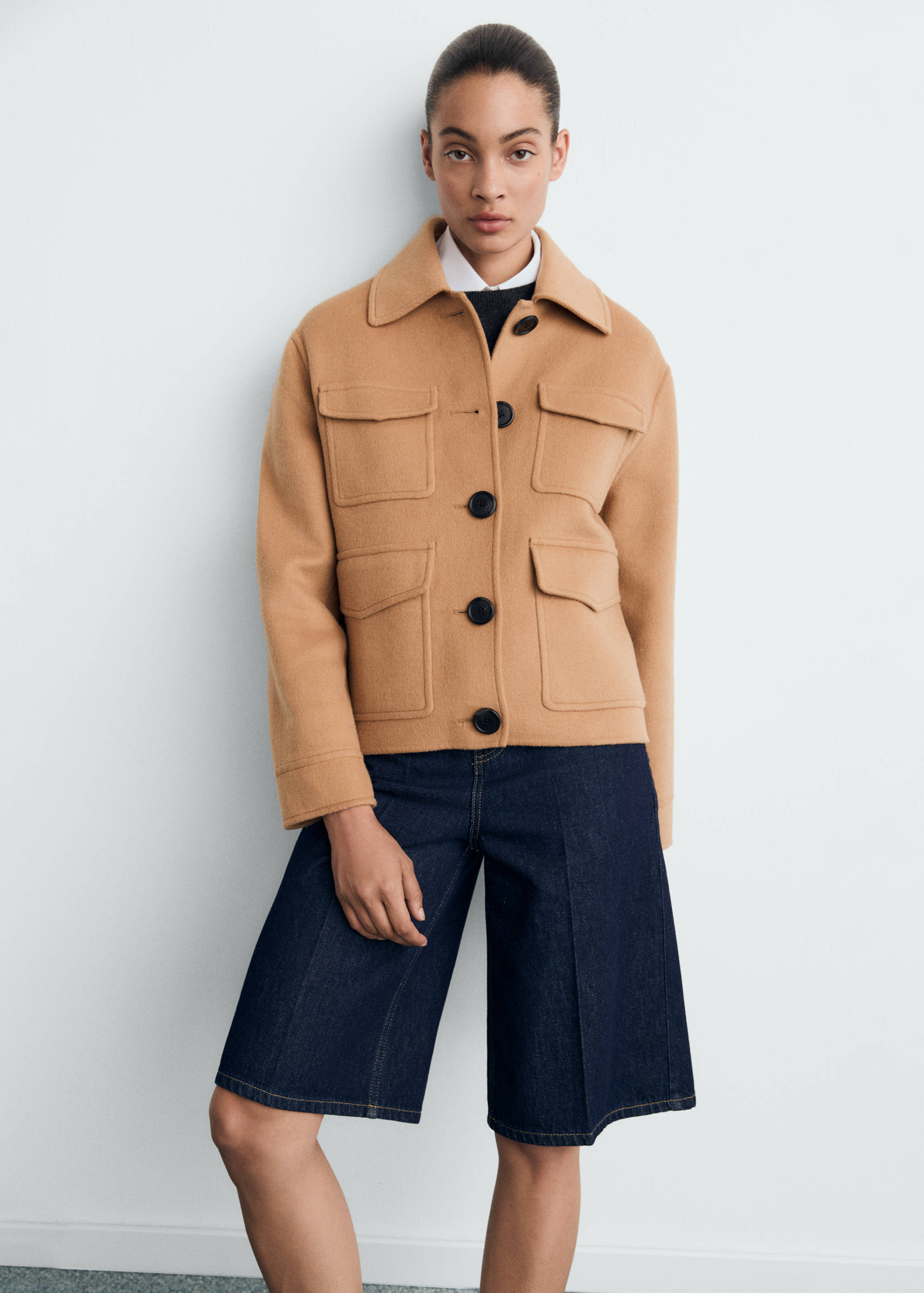 Camel jacket with flap pockets and large buttons.