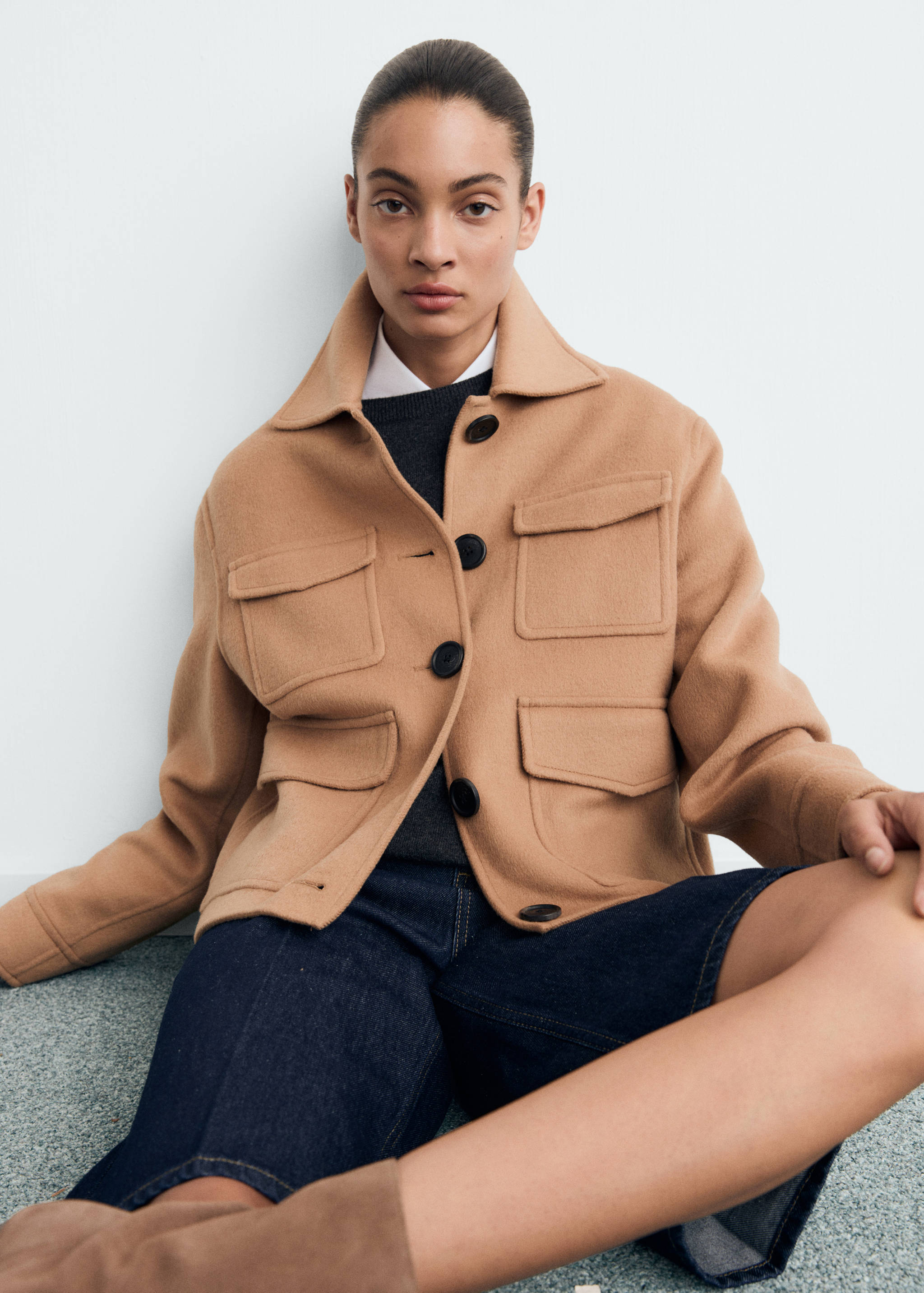 Camel jacket with shirt collar and four patch pockets.