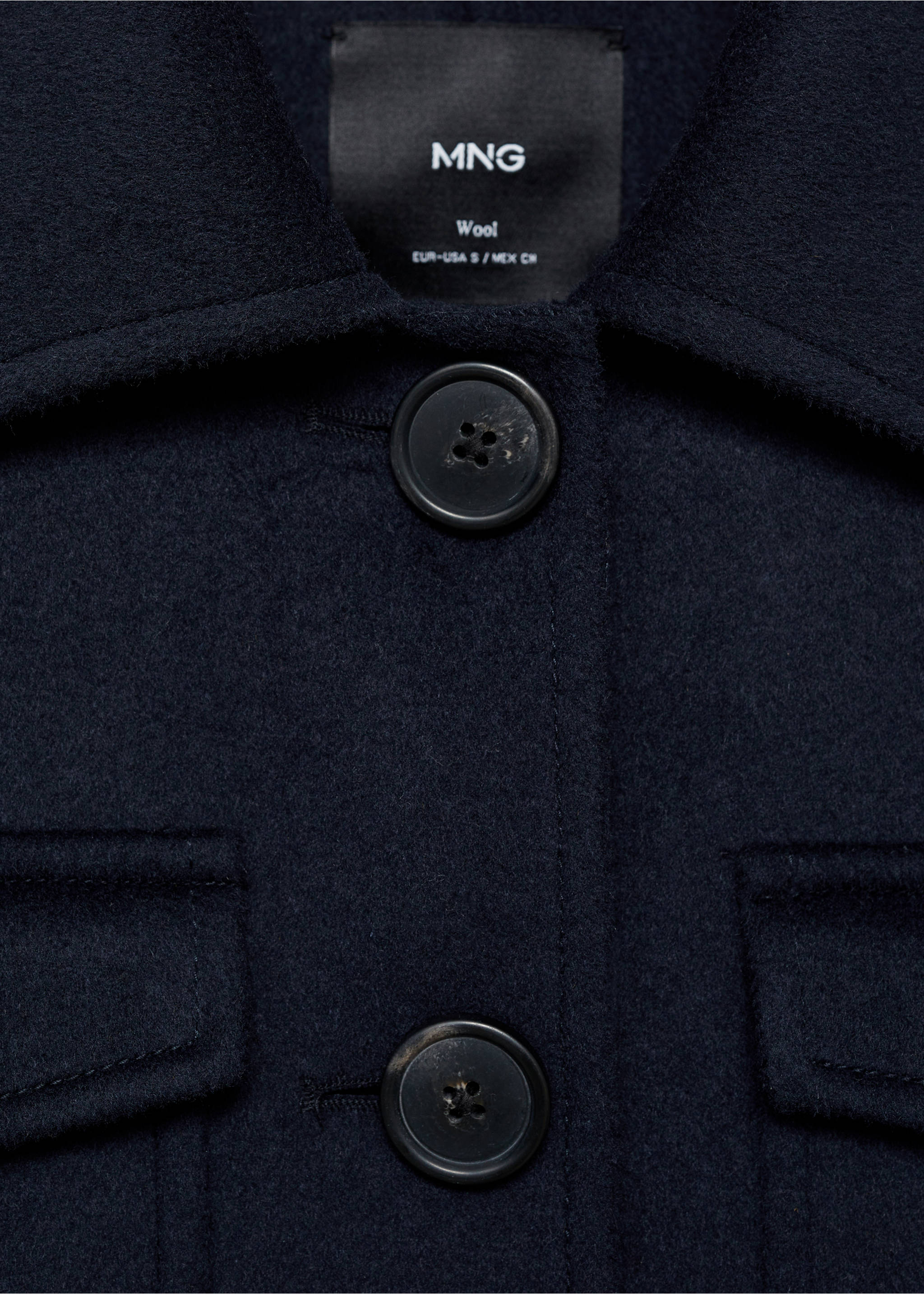 Dark navy wool jacket detail showing the collar, buttons, and chest pockets., Dark Navy. Ref: 87062539-00.