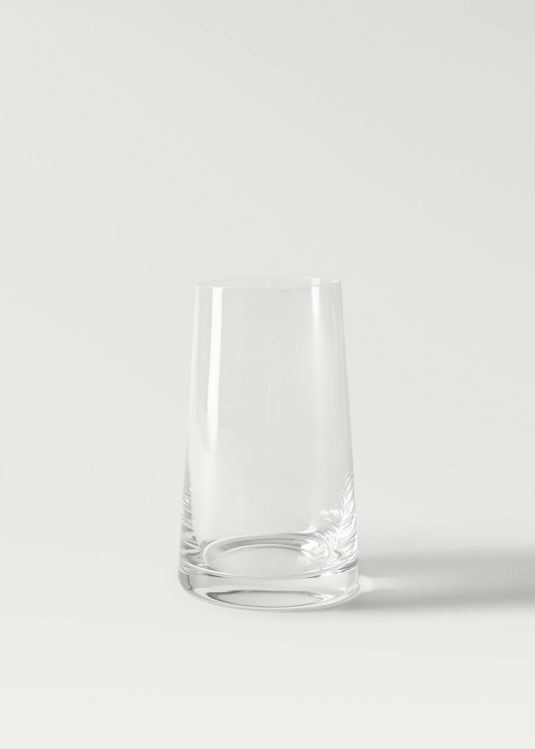 Clear glass vase in a still-life setting.