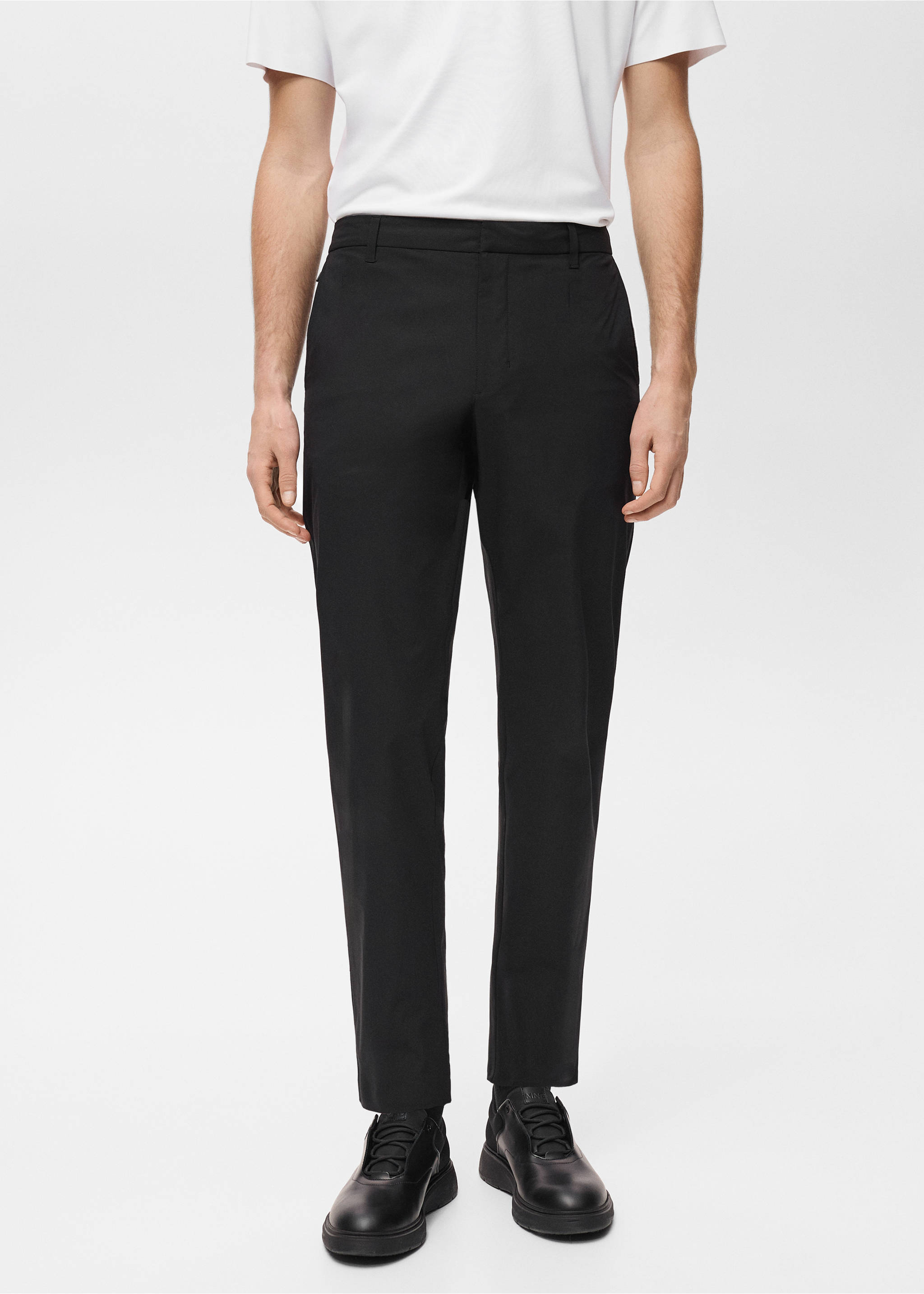 Black slim-fit trousers worn with a white t-shirt., Black. Ref: 87064389-00.