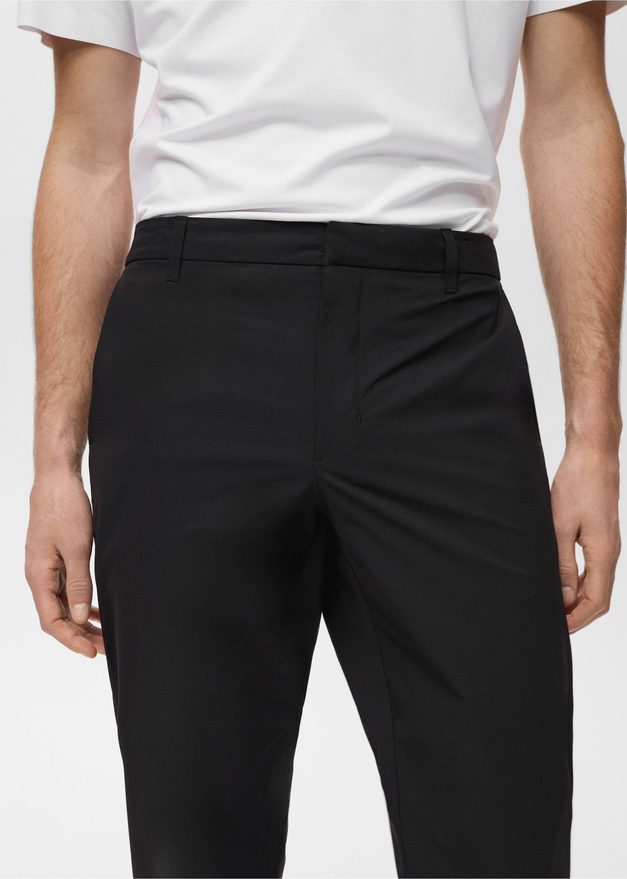 Black trousers featuring a fitted waistband with belt loops., Black. Ref: 87064389-00.