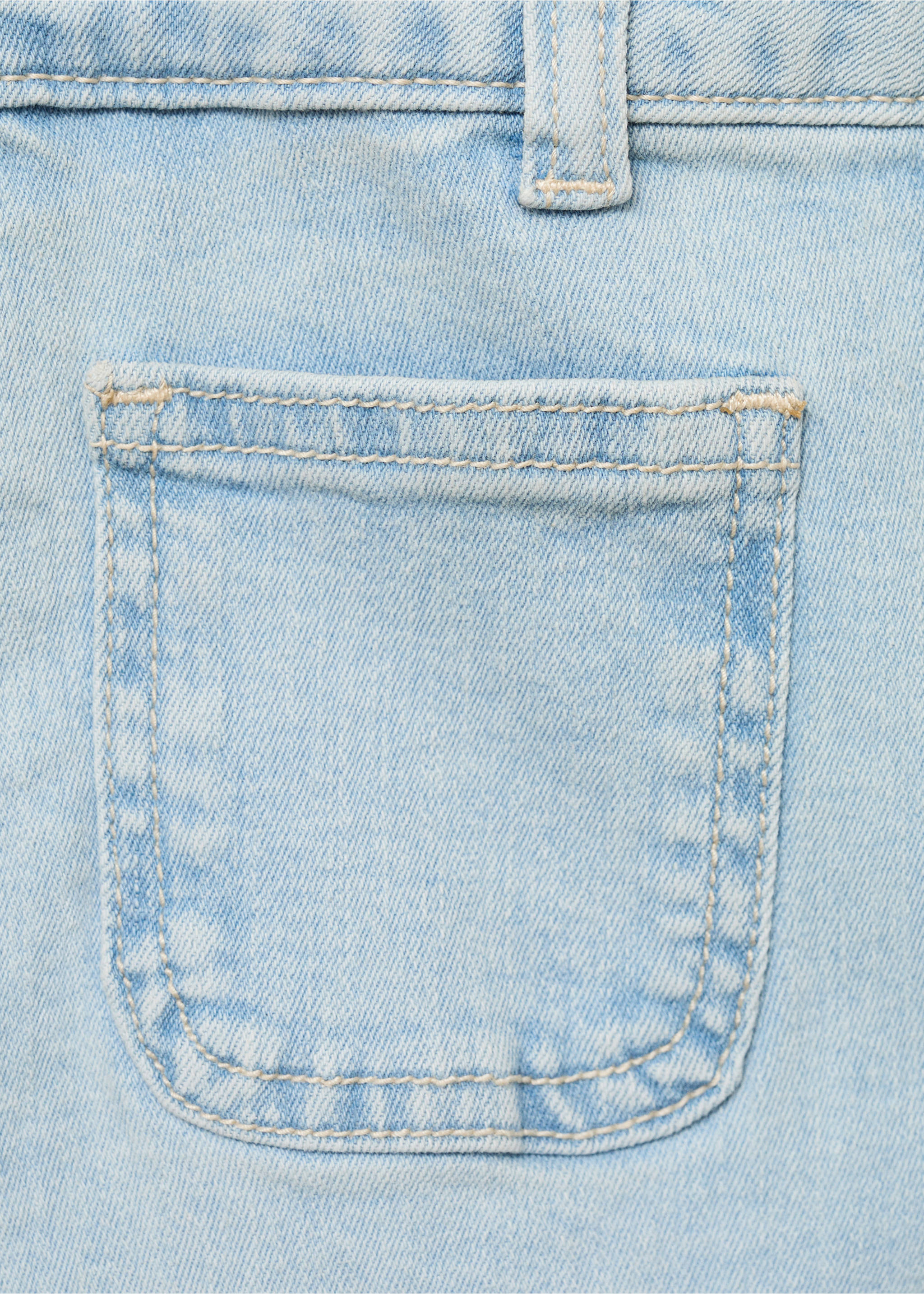 Close-up of light blue denim shorts showing pocket and topstitching detail., Light Blue. Ref: 87066711-00.