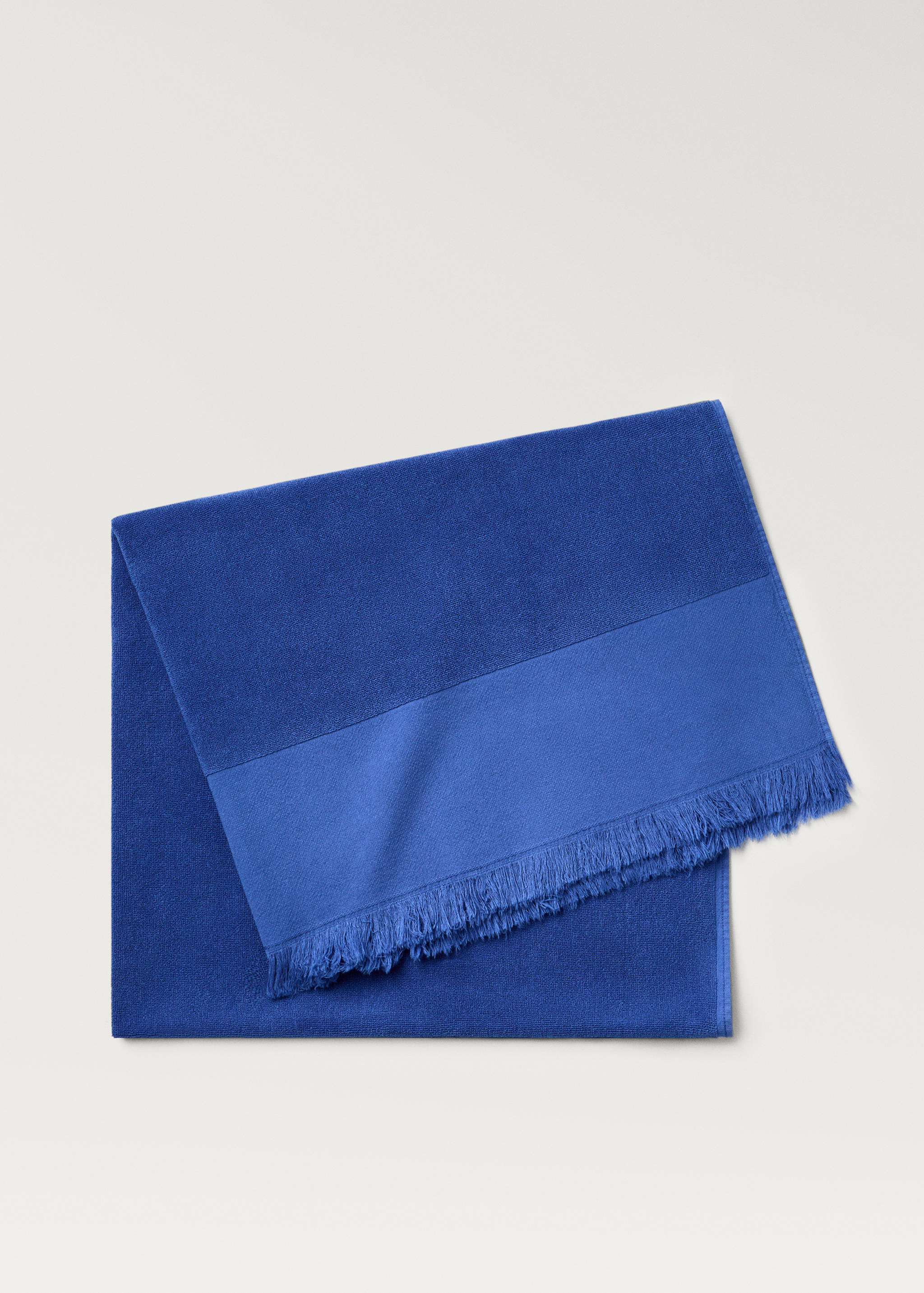 Overdyed terry beach towel with fringes - Home | MANGO OUTLET