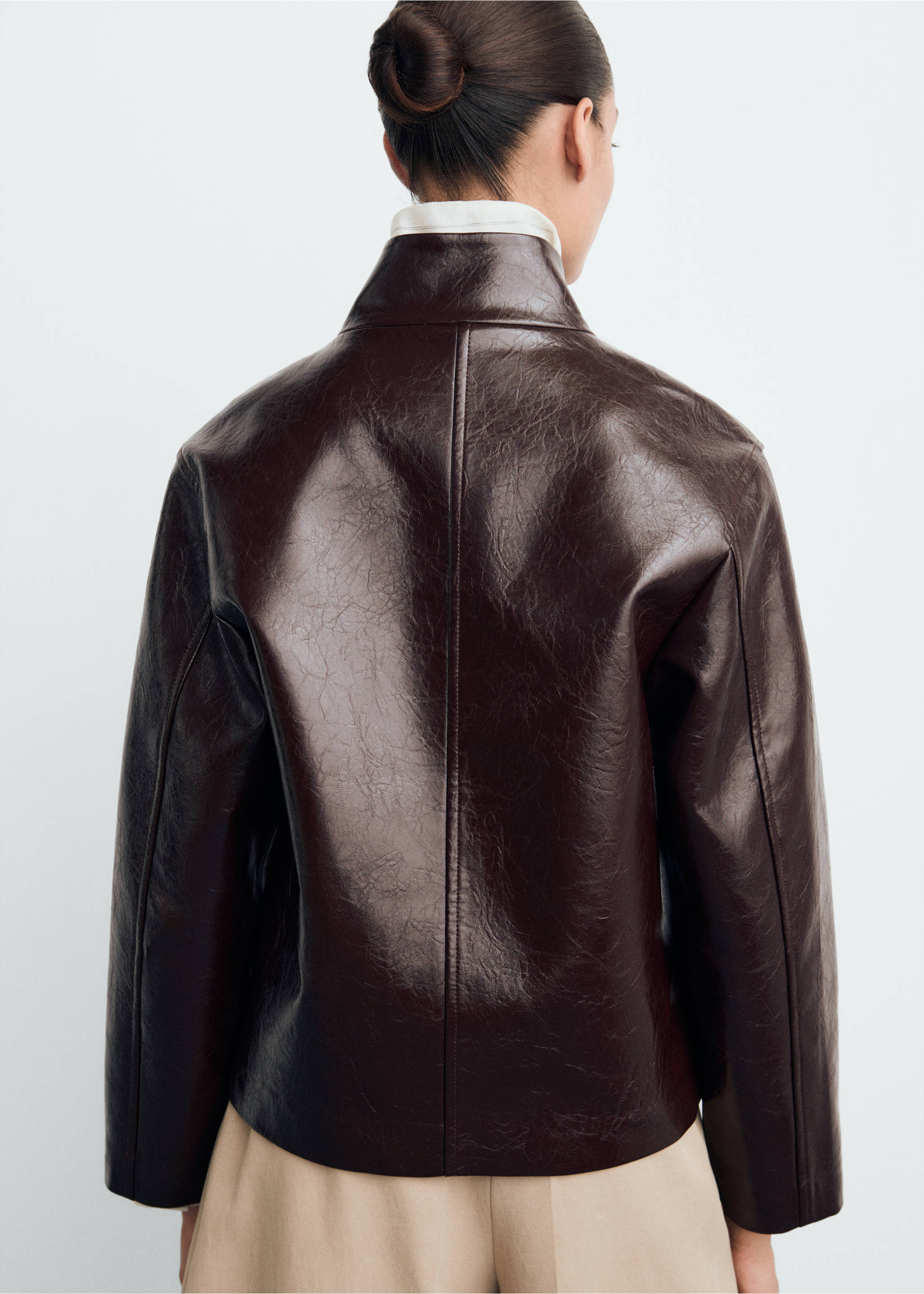 Dark brown crinkled jacket shown from the back with a high collar., Brown. Ref: 87070640-00.