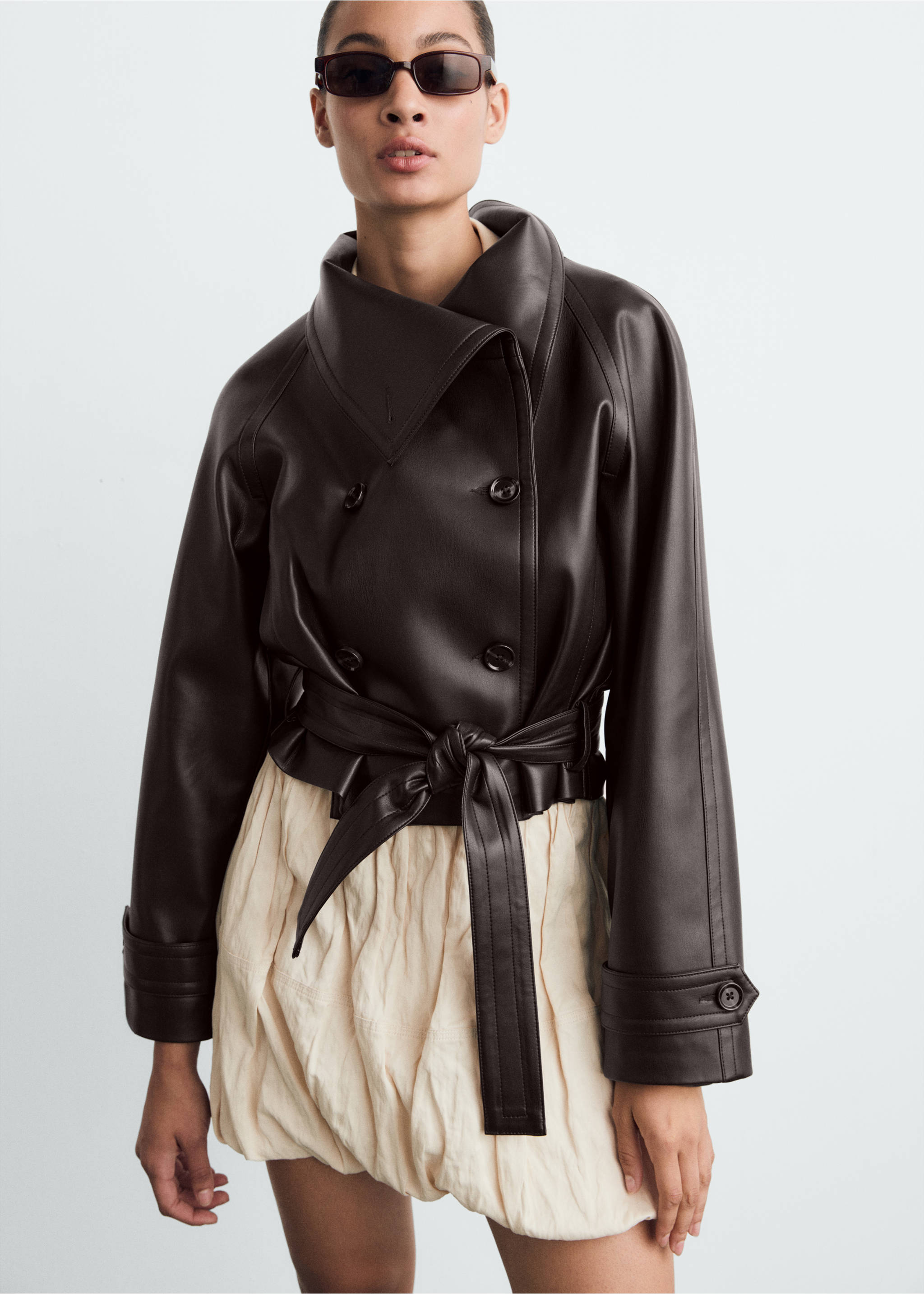 Dark brown faux-leather double-breasted jacket with a high funnel collar and a self-tie waist belt., Brown. Ref: 87070651-00.