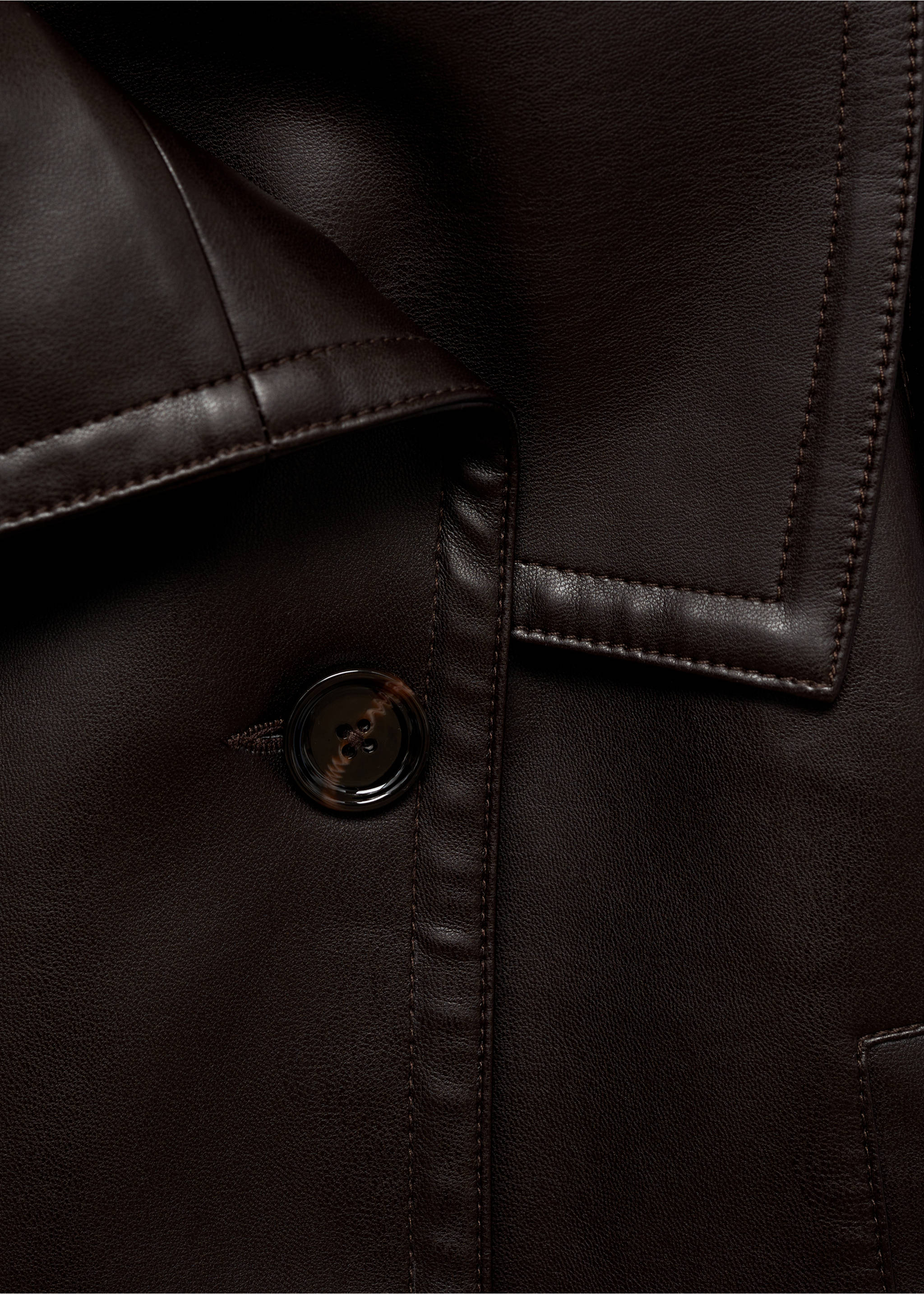 Dark brown jacket close-up with lapel and button detail., Brown. Ref: 87070651-00.