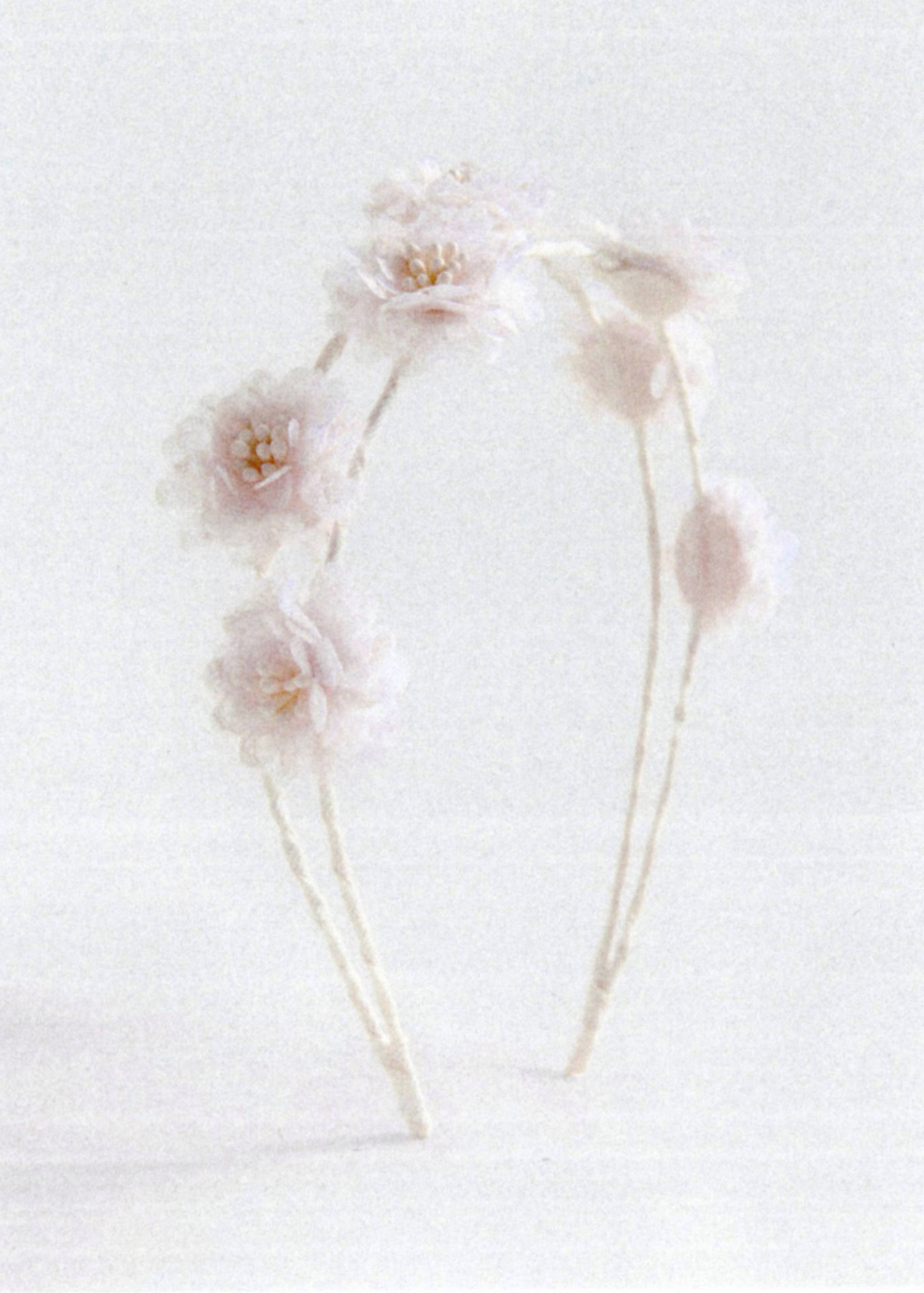 Pale pink floral headband with fabric flowers and beaded centres.