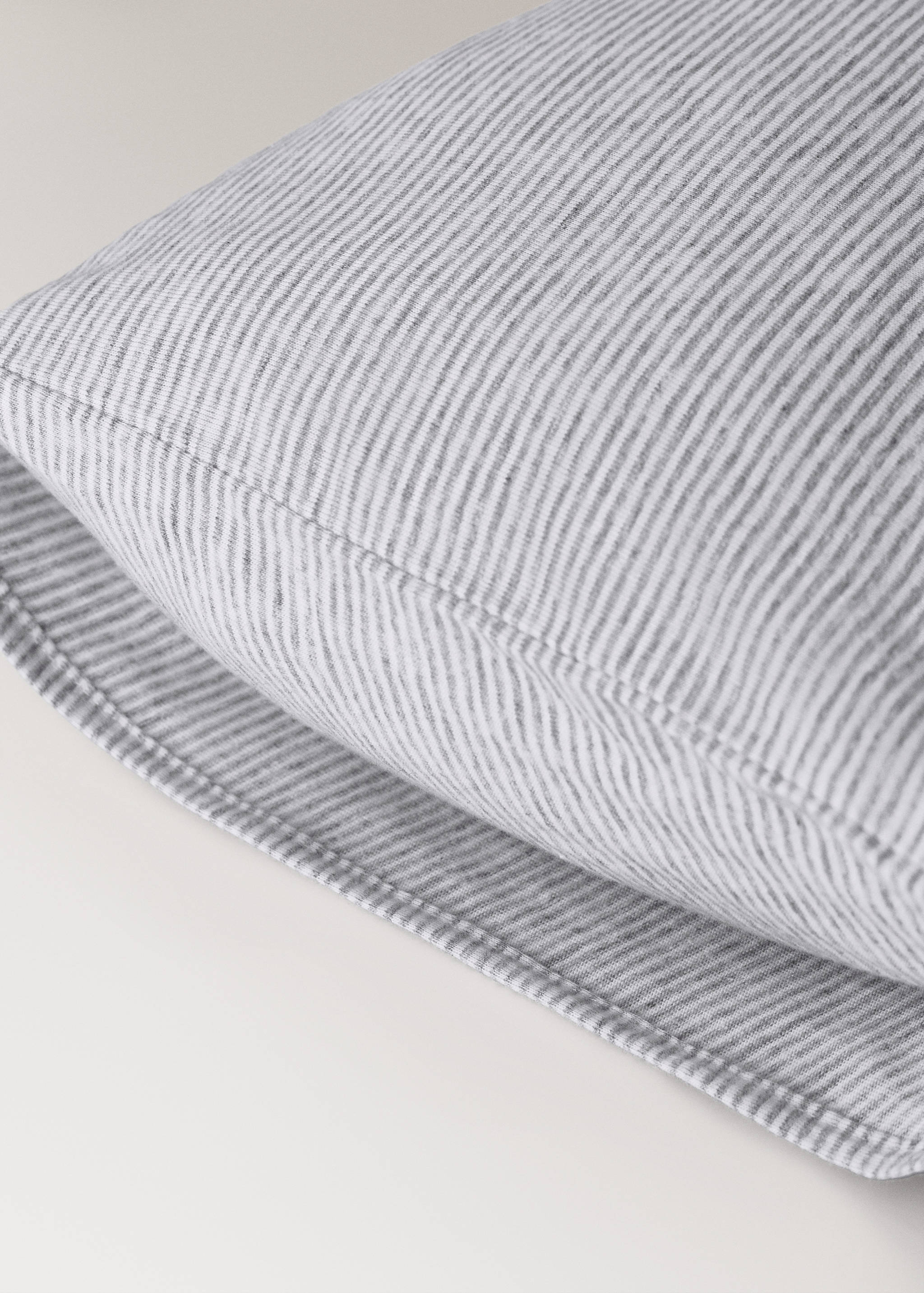 Grey and white striped cot pillowcase product detail.