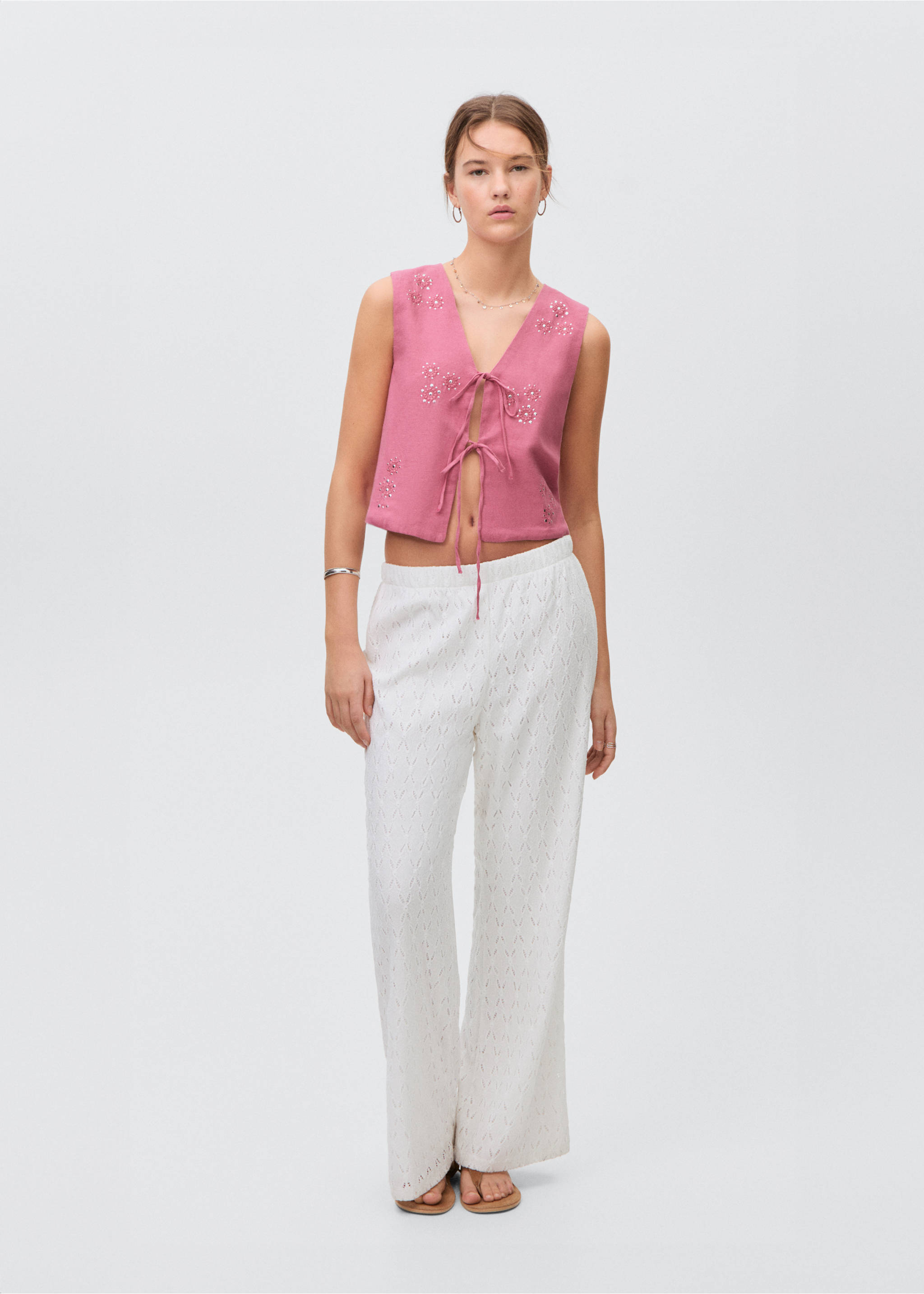 Armilla brodat llaços - Pla general, Rosa. Ref: 87076347-00.