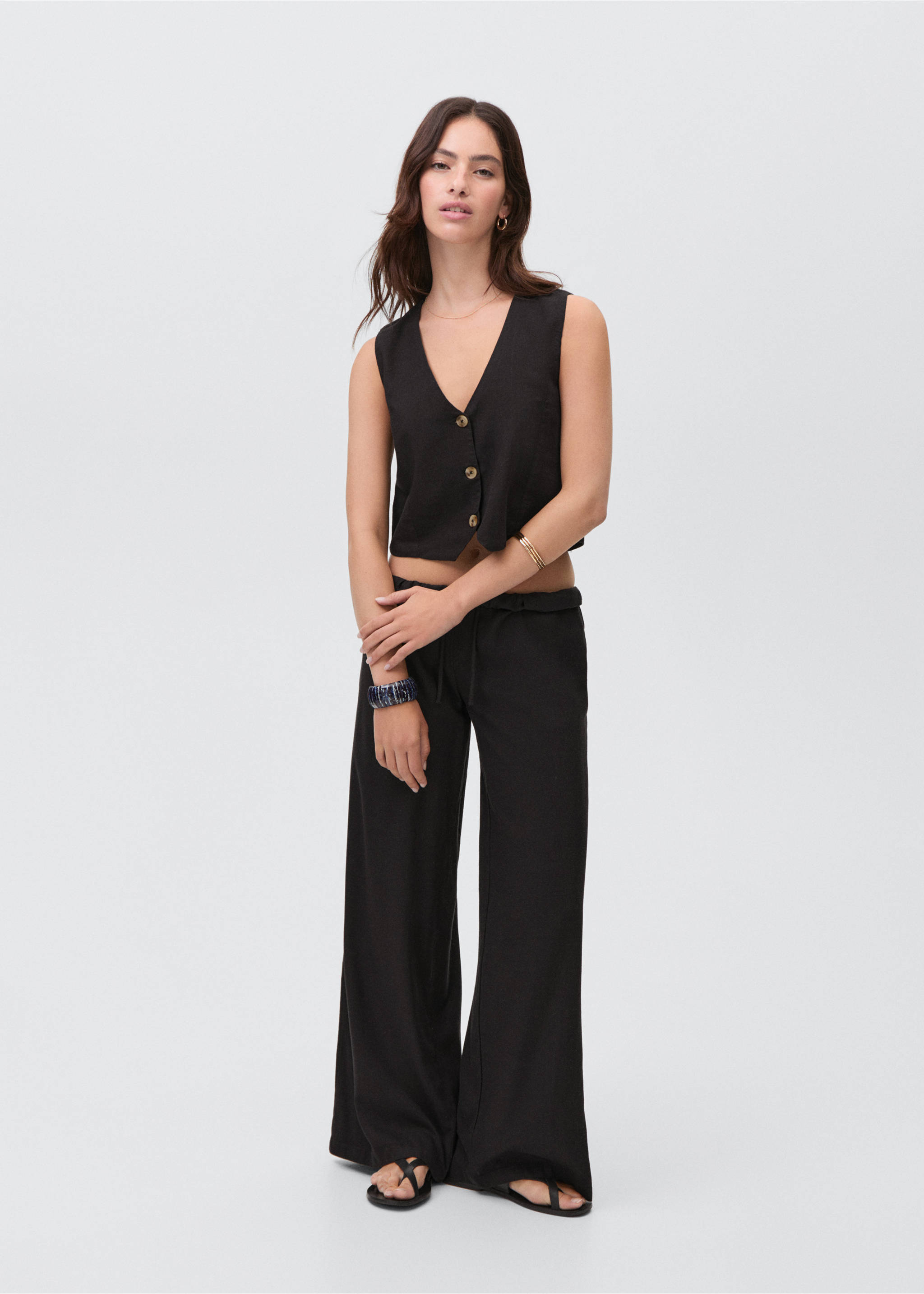 Armilla lli botons - Pla general, Negre. Ref: 87076348-00.